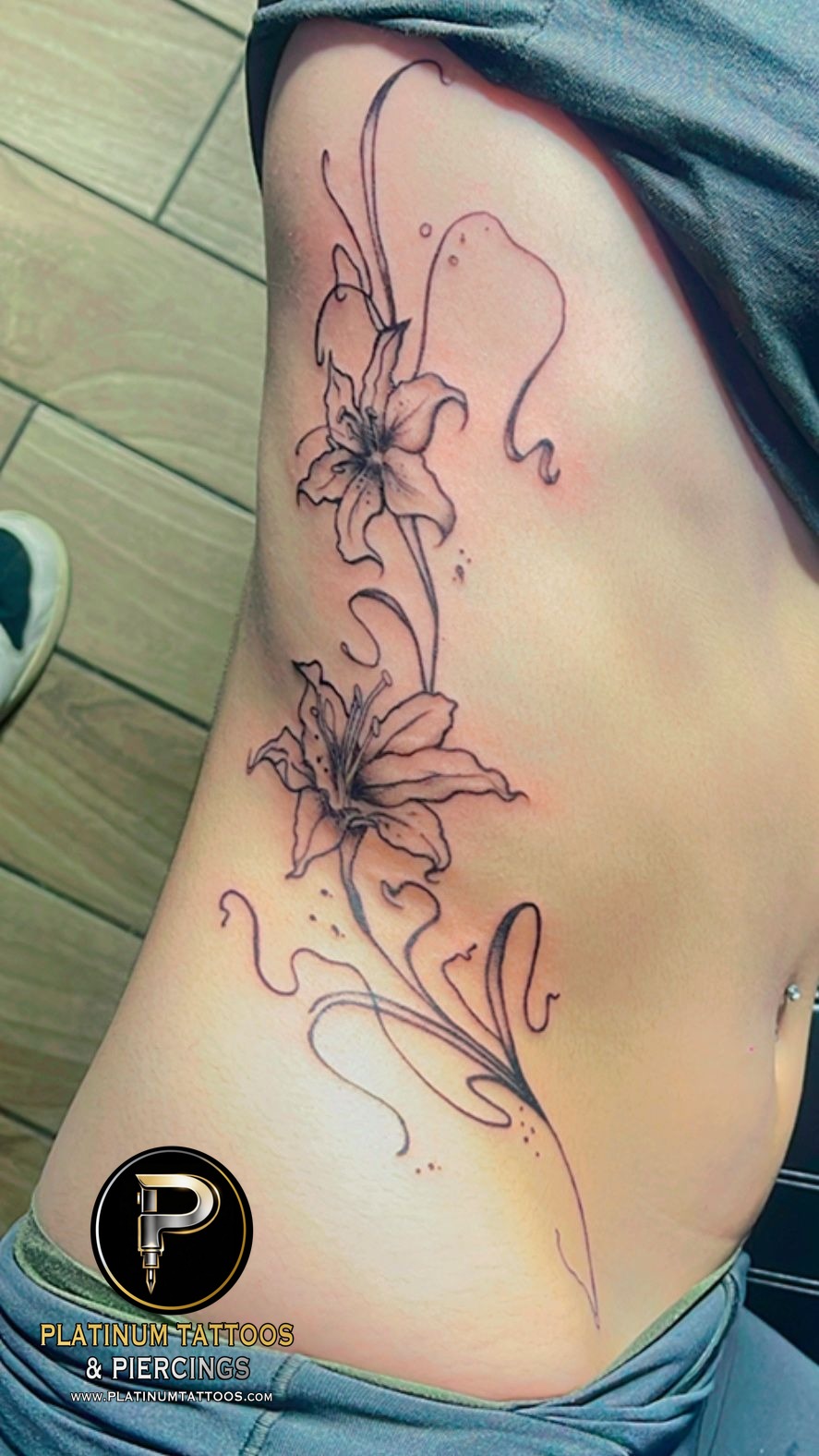 Floral tattoo on the ribs by Skar at Platinum Tattoos & Piercings, San Antonio TX