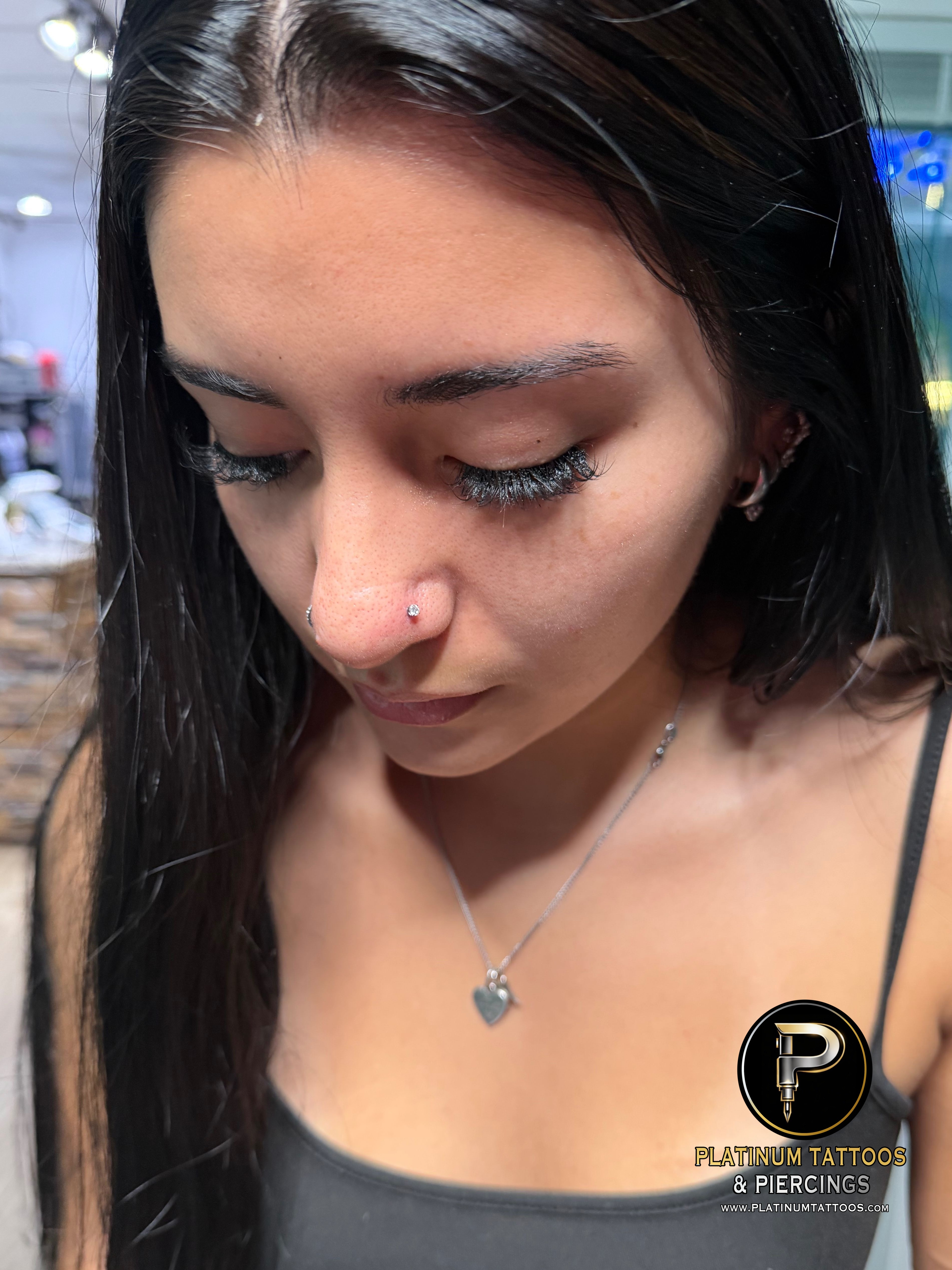 Threadless piercing on the Nostril by Mingo at Platinum Tattoos & Piercings, San Antonio TX