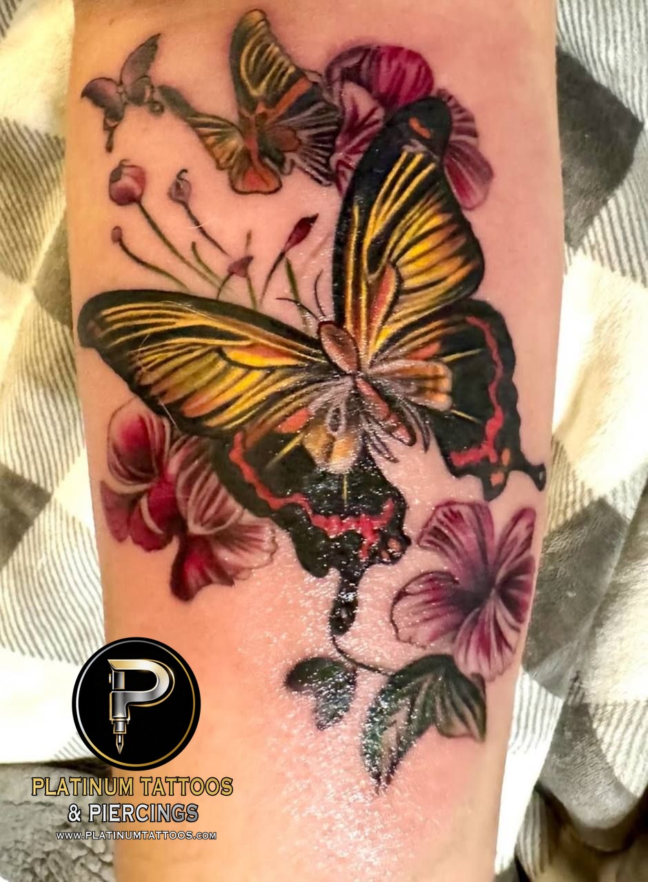 Color realism tattoo on the forearm at Platinum Tattoos & Piercings, San Antonio TX