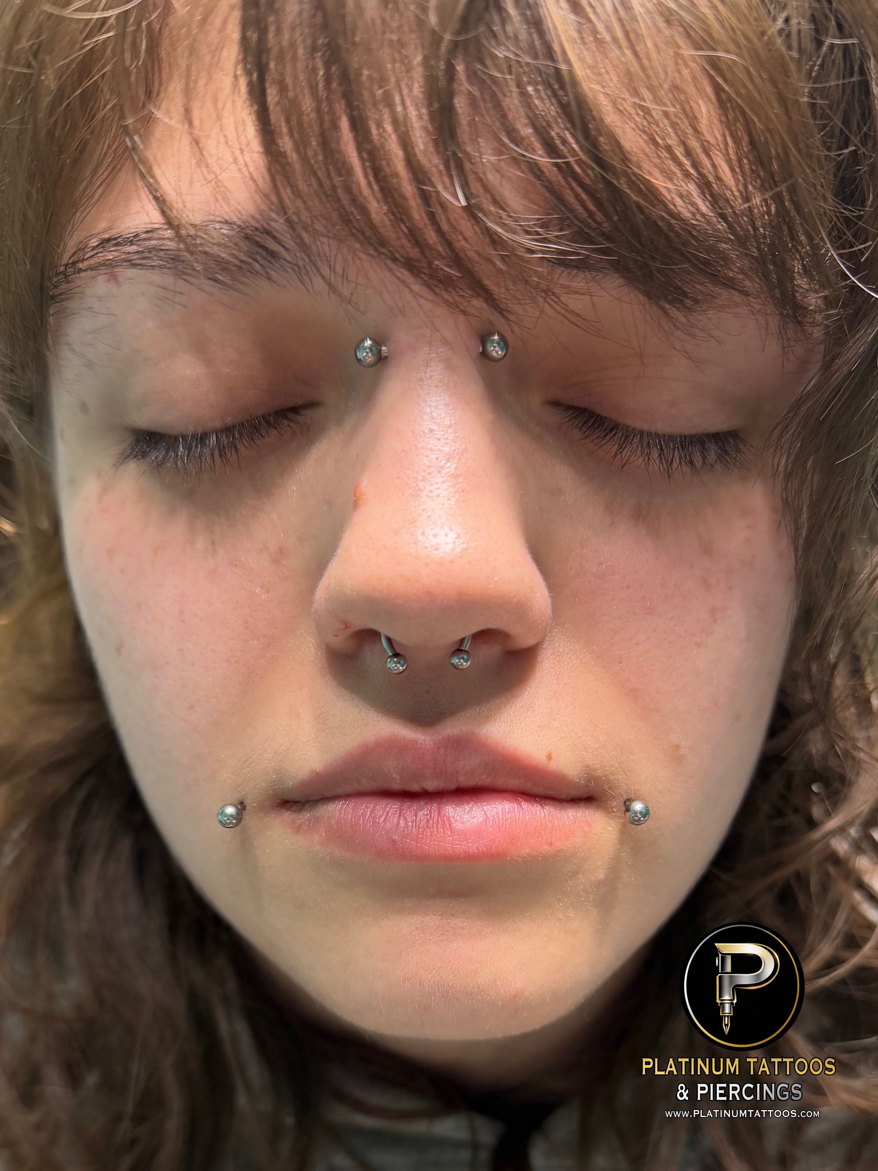 Circular Barbell, Barbell, Labret Stud/Flat Back piercing on the Septum, Bridge, Dahlia by Mingo at Platinum Tattoos & Piercings, San Antonio TX