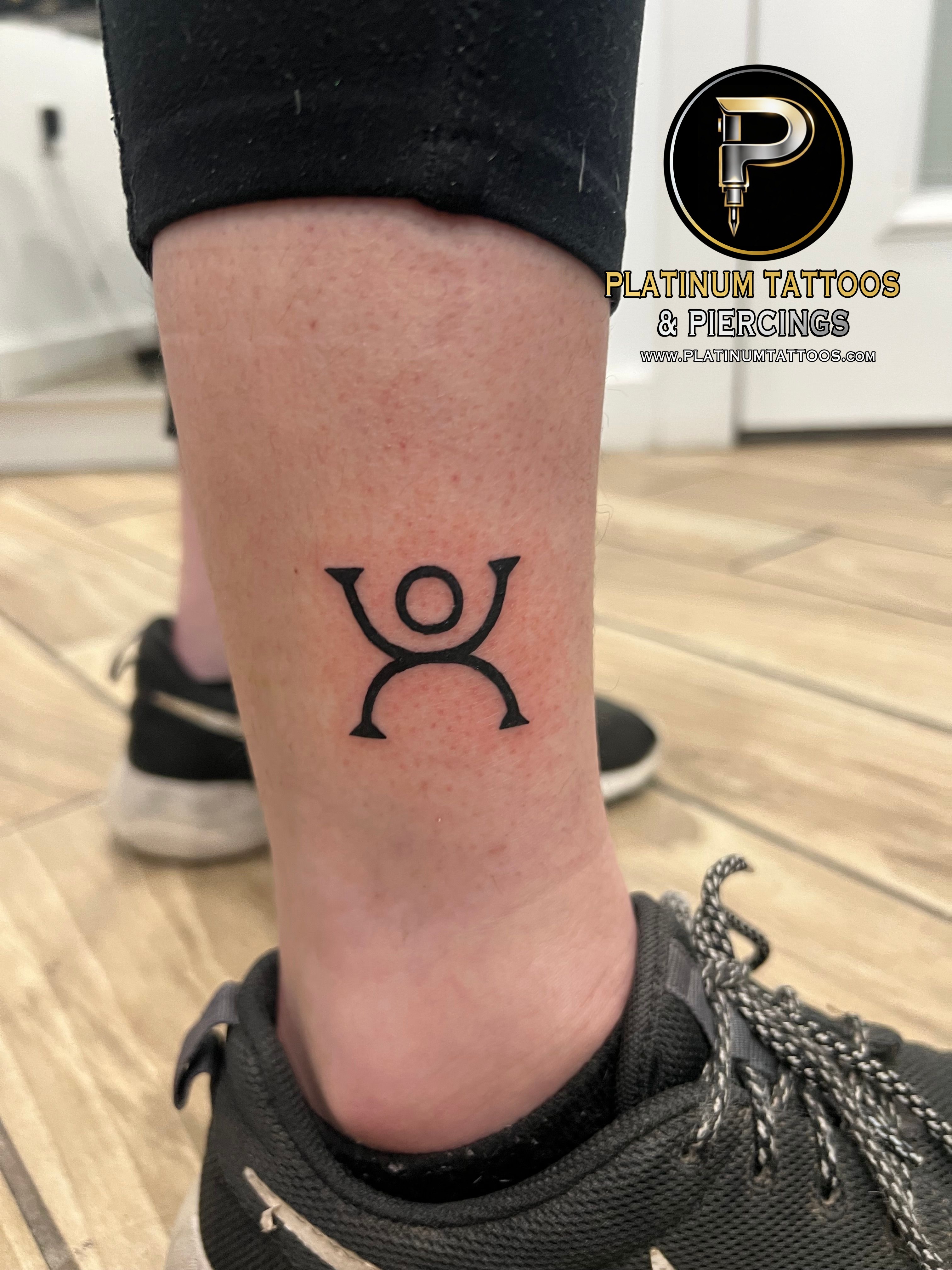 Floral & Tribal tattoo on the ankle by Jesus at Platinum Tattoos Piercings, San Antonio TX