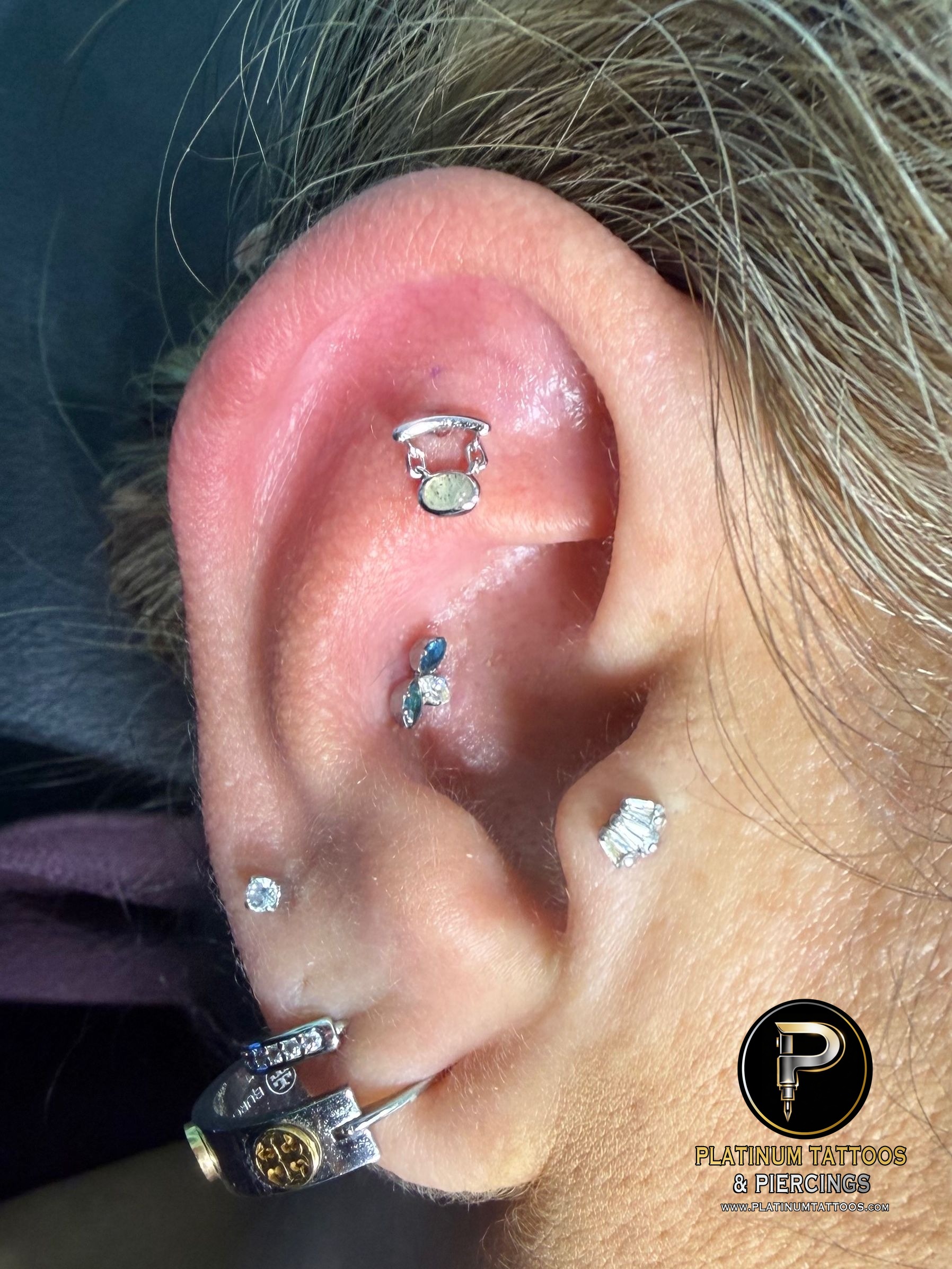 Flat piercing with 14k White Gold Cluster/Multi-Gem by Junipurr by Mingo at Platinum Tattoos & Piercings, San Antonio TX
