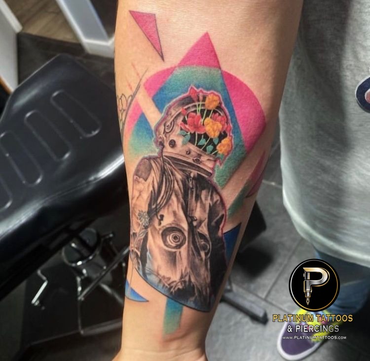 Color, Black & Grey with Color, Abstract Black, White, Pink, Blue, Green, Grey, Multi-Color Flower, Astronaut tattoo on the Forearm at Platinum Tattoos & Piercings, San Antonio TX
