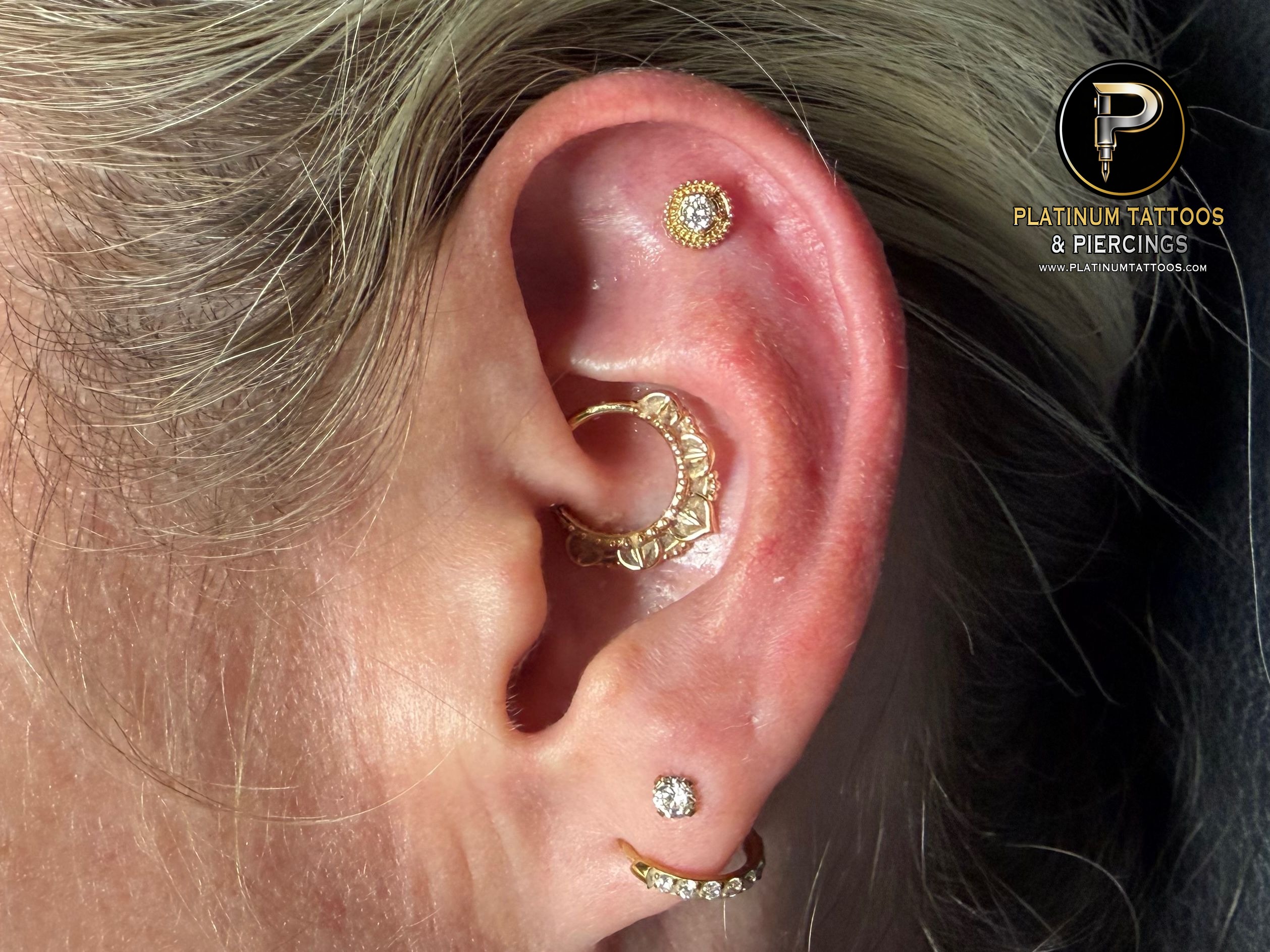 Flat piercing with 14k Yellow Gold Threadless by Tawapa by Mingo at Platinum Tattoos & Piercings, San Antonio TX