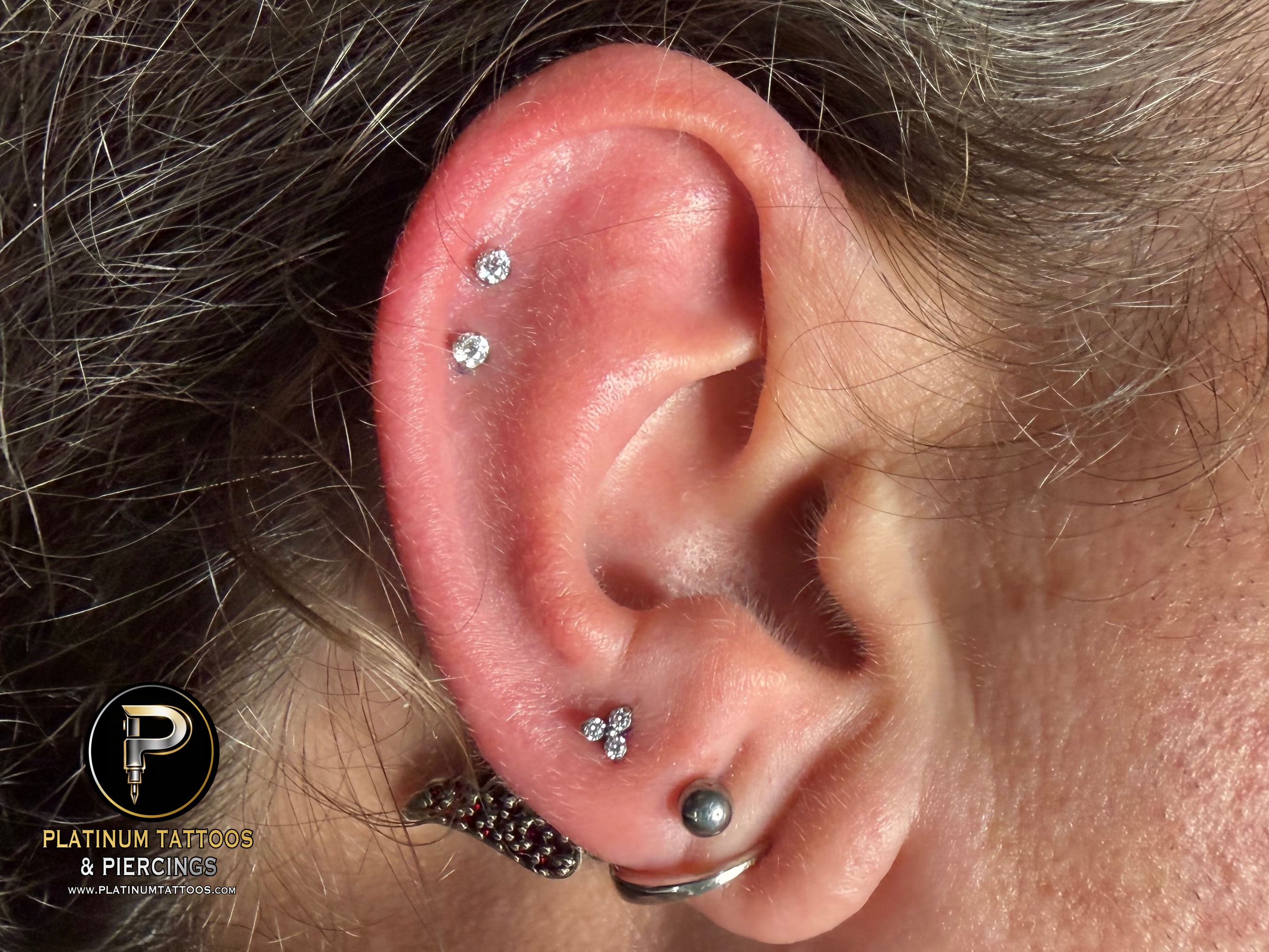 Curated ear piercing setup โ 3rd Lobe, 1st Helix, 2nd Helix with Implant Grade Titanium Cluster/Multi-Gem, Threadless by NeoMetal by Mingo at Platinum Tattoos & Piercings, San Antonio TX