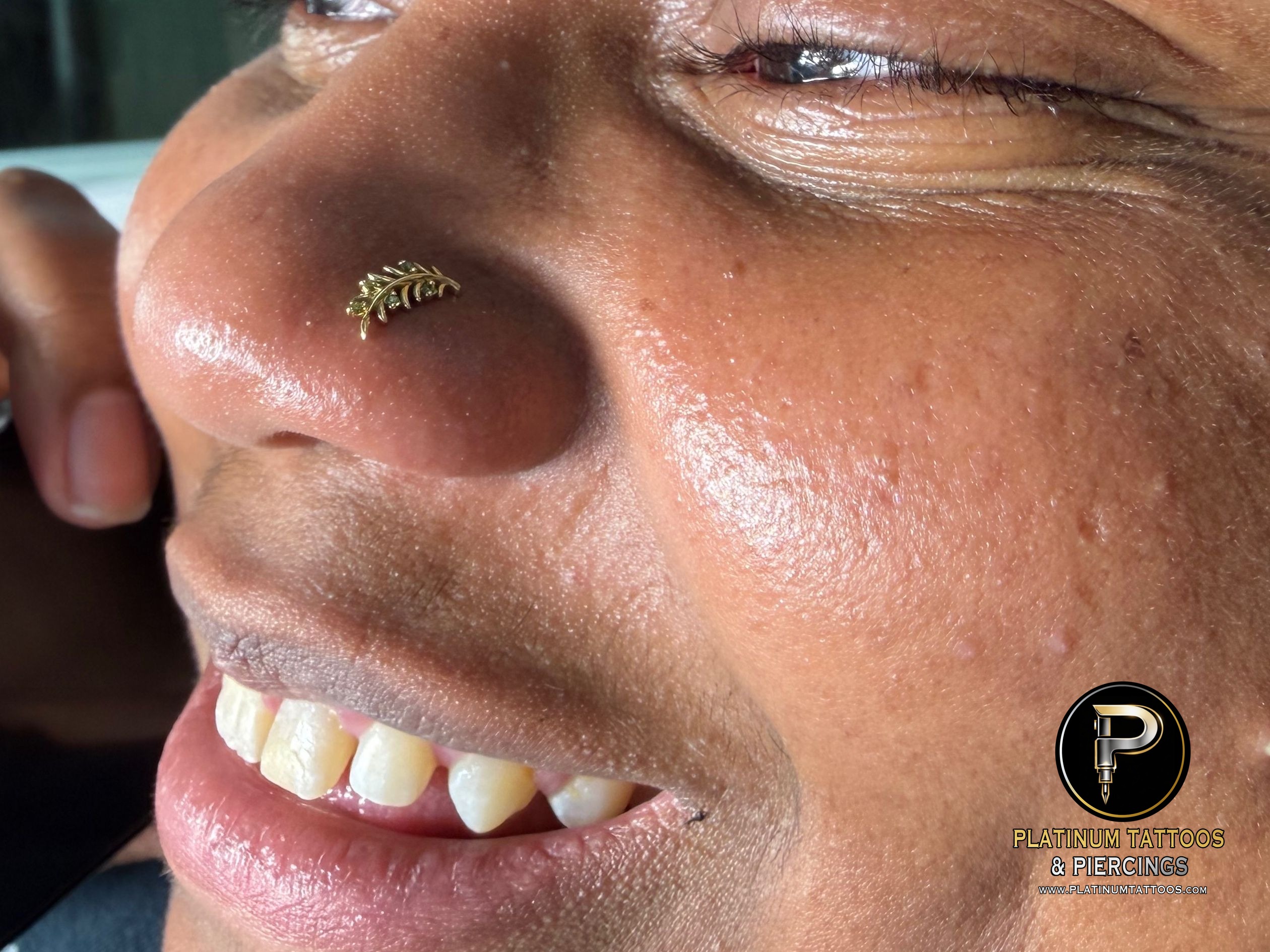 Nostril piercing with 14k Yellow Gold Threadless by Mingo at Platinum Tattoos & Piercings, San Antonio TX