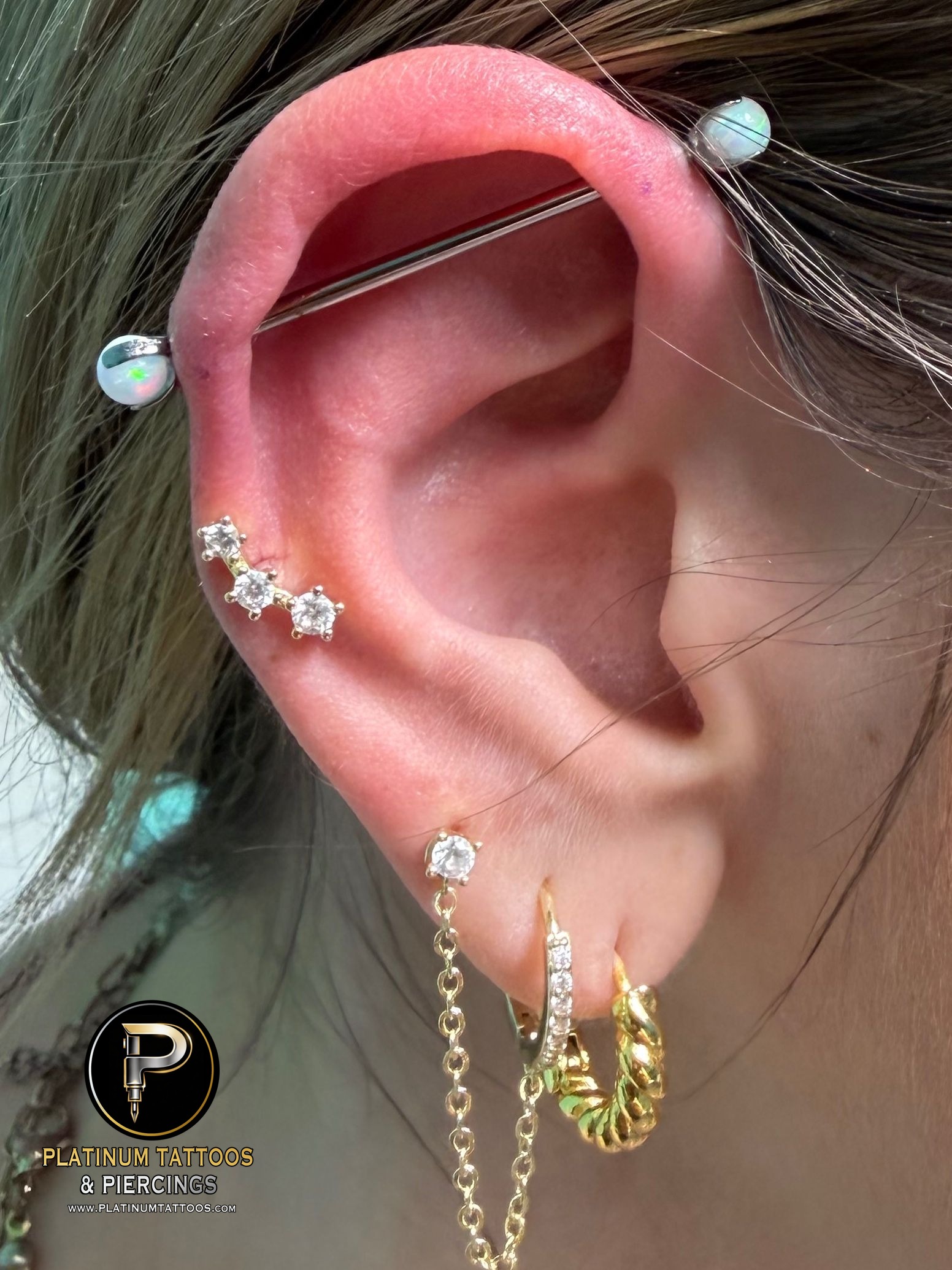 Industrial piercing with Implant Grade Titanium Barbell by Industrial Strength by Mingo at Platinum Tattoos & Piercings, San Antonio TX