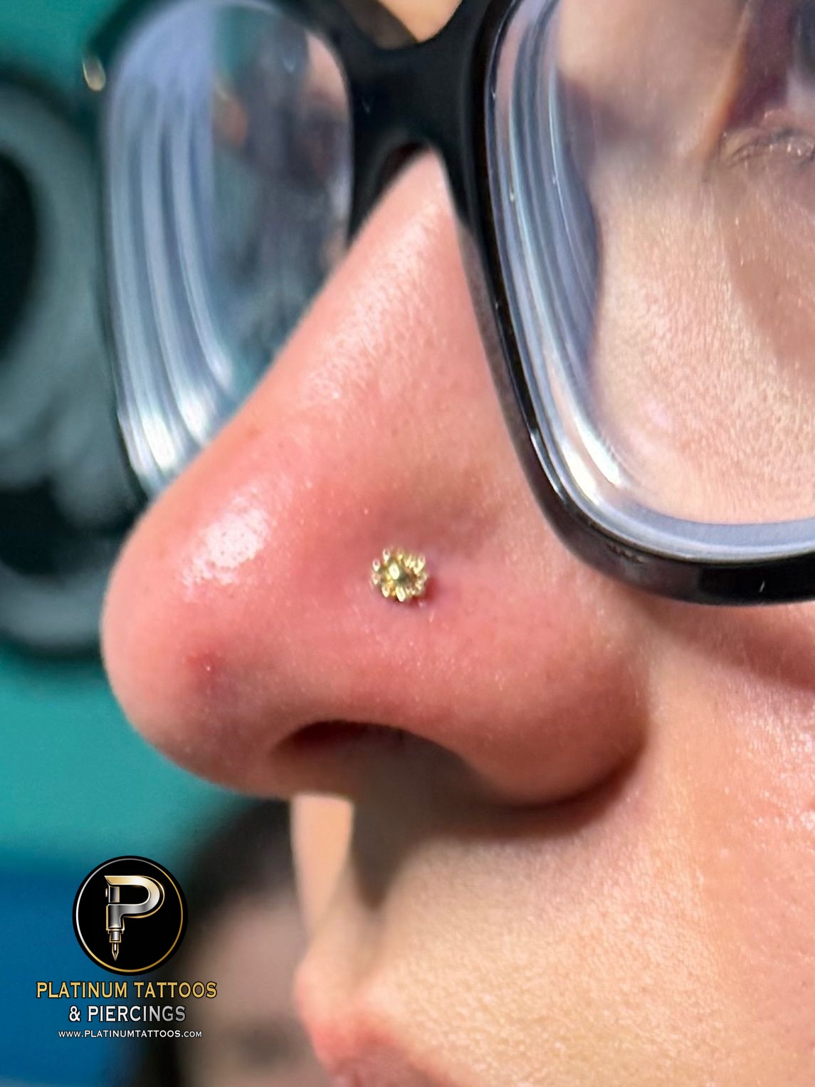 Nostril piercing with 14k Yellow Gold Threadless by Tawapa by Mingo at Platinum Tattoos & Piercings, San Antonio TX