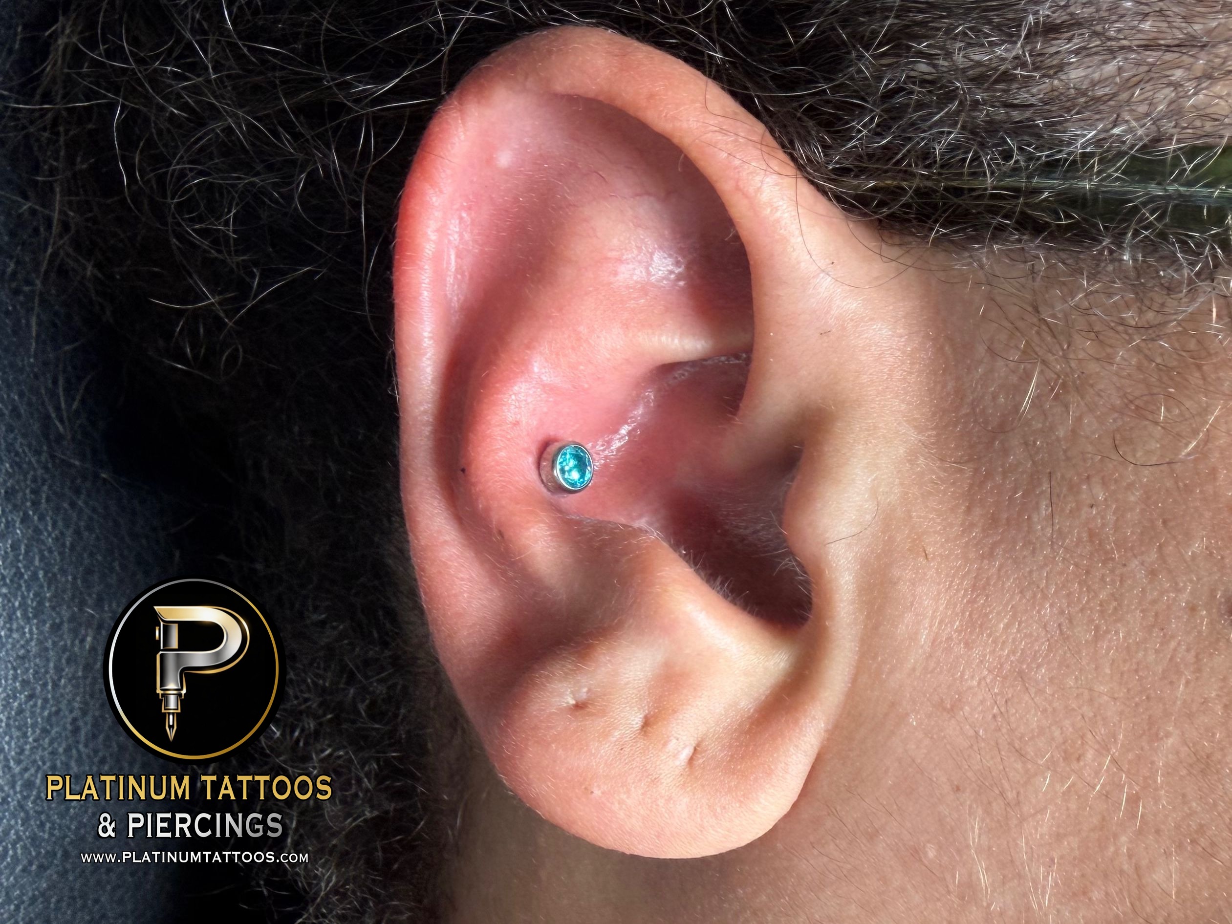 Conch piercing with Implant Grade Titanium Threadless by NeoMetal by Mingo at Platinum Tattoos & Piercings, San Antonio TX