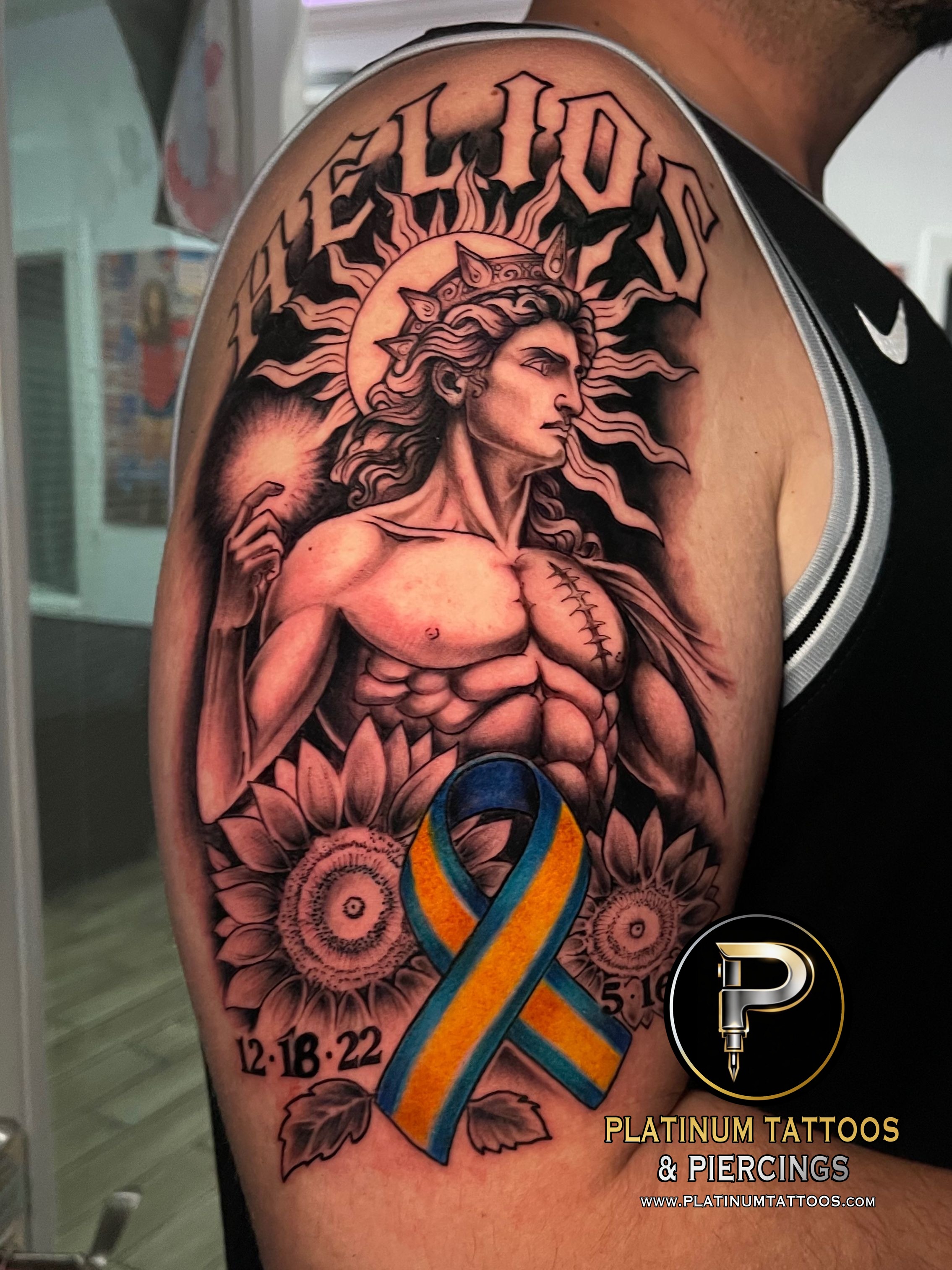 Black & Grey Black, Yellow, Blue tattoo on the Upper Arm by Skar at Platinum Tattoos & Piercings, San Antonio TX