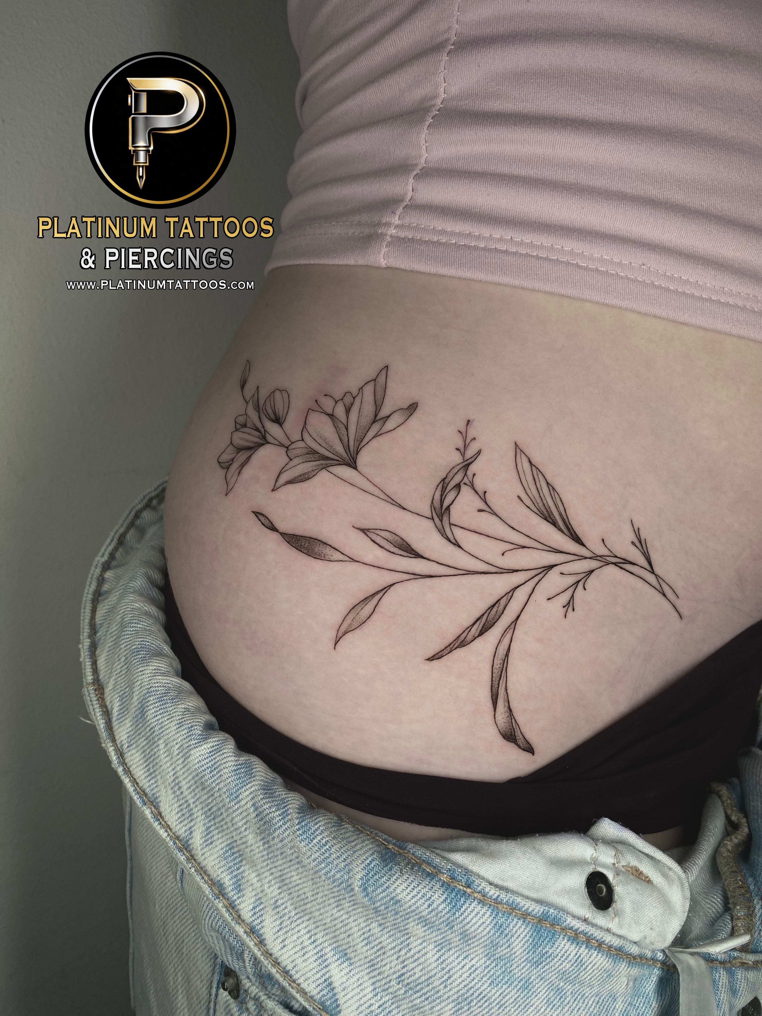 Blackwork, Fine Line Black Flower tattoo on the Stomach by Remy at Platinum Tattoos & Piercings, San Antonio TX