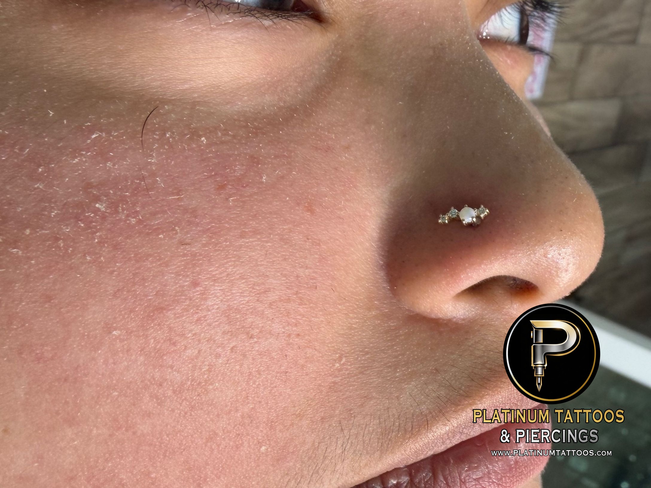 Nostril piercing with 14k Yellow Gold Cluster/Multi-Gem by Mingo at Platinum Tattoos & Piercings, San Antonio TX