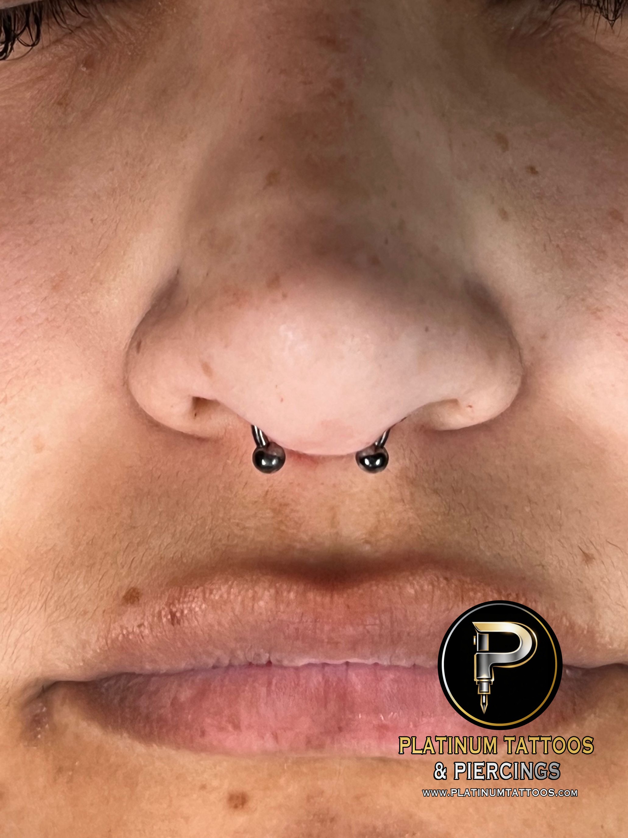 Septum piercing with Implant Grade Titanium Circular Barbell by Other by Harley at Platinum Tattoos & Piercings, San Antonio TX