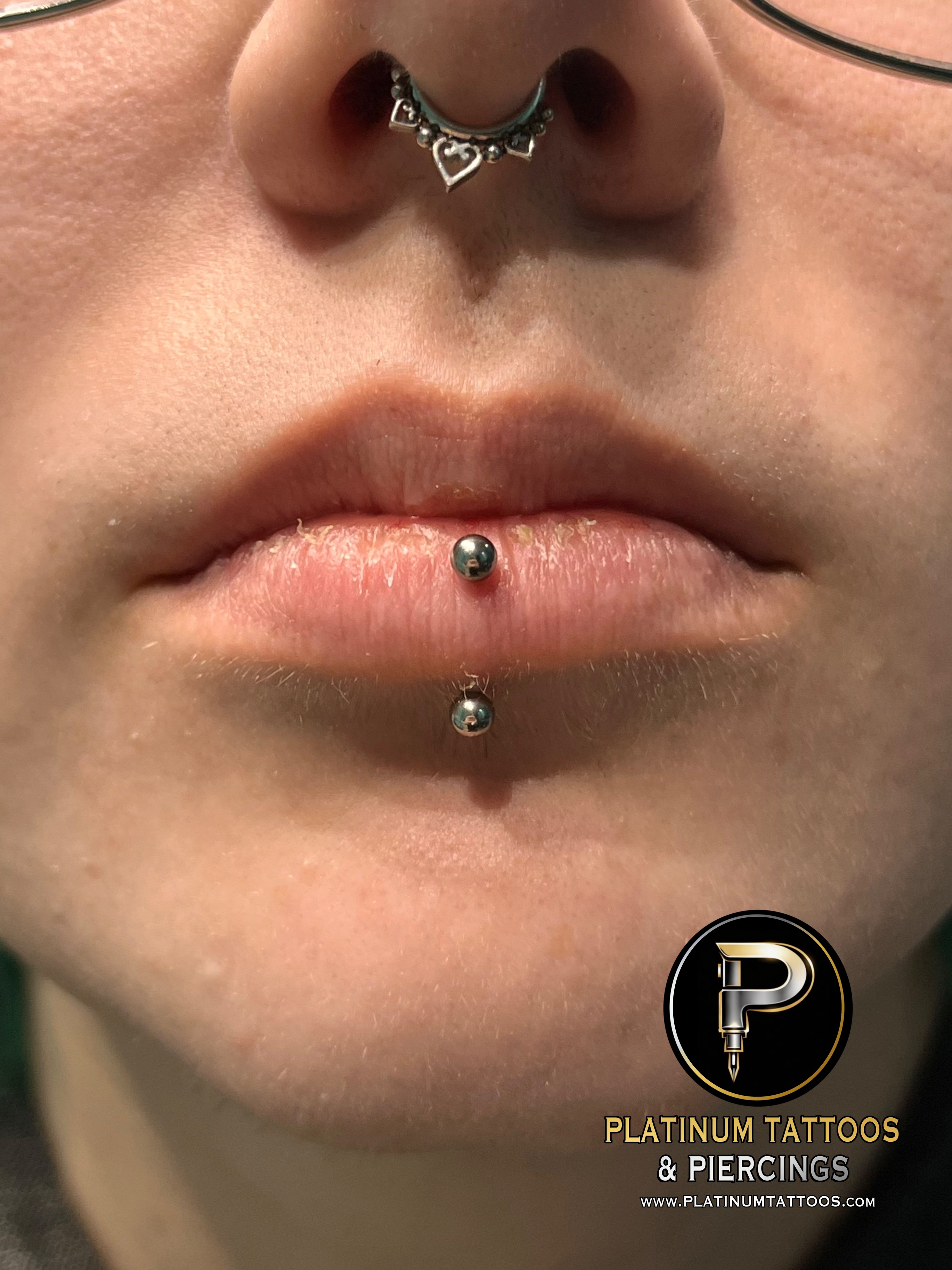 Vertical Labret piercing with Implant Grade Titanium Curved Barbell by Other by Harley at Platinum Tattoos & Piercings, San Antonio TX