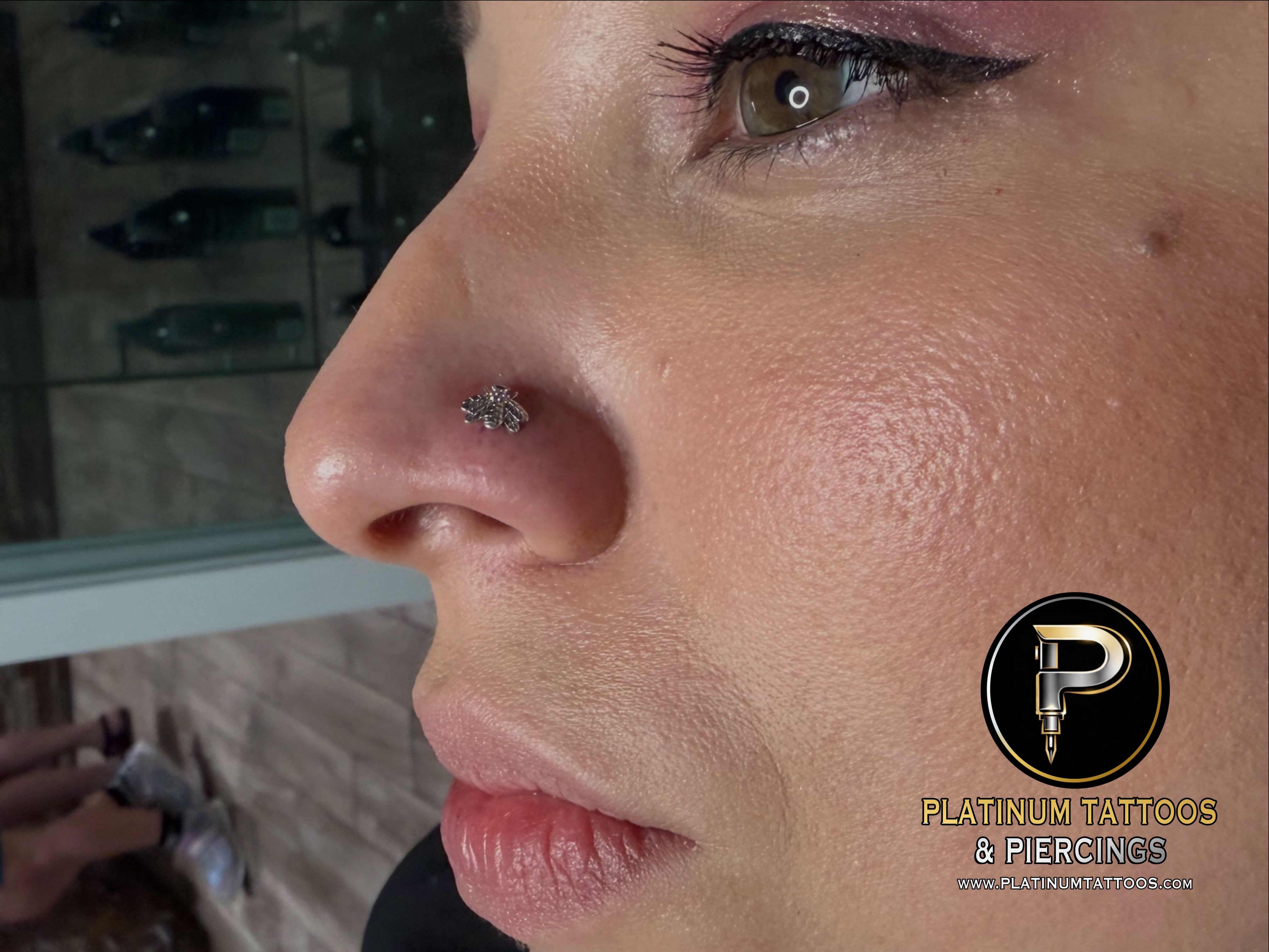 Nostril piercing with 14k White Gold Labret Stud/Flat Back by Junipurr by Mingo at Platinum Tattoos & Piercings, San Antonio TX