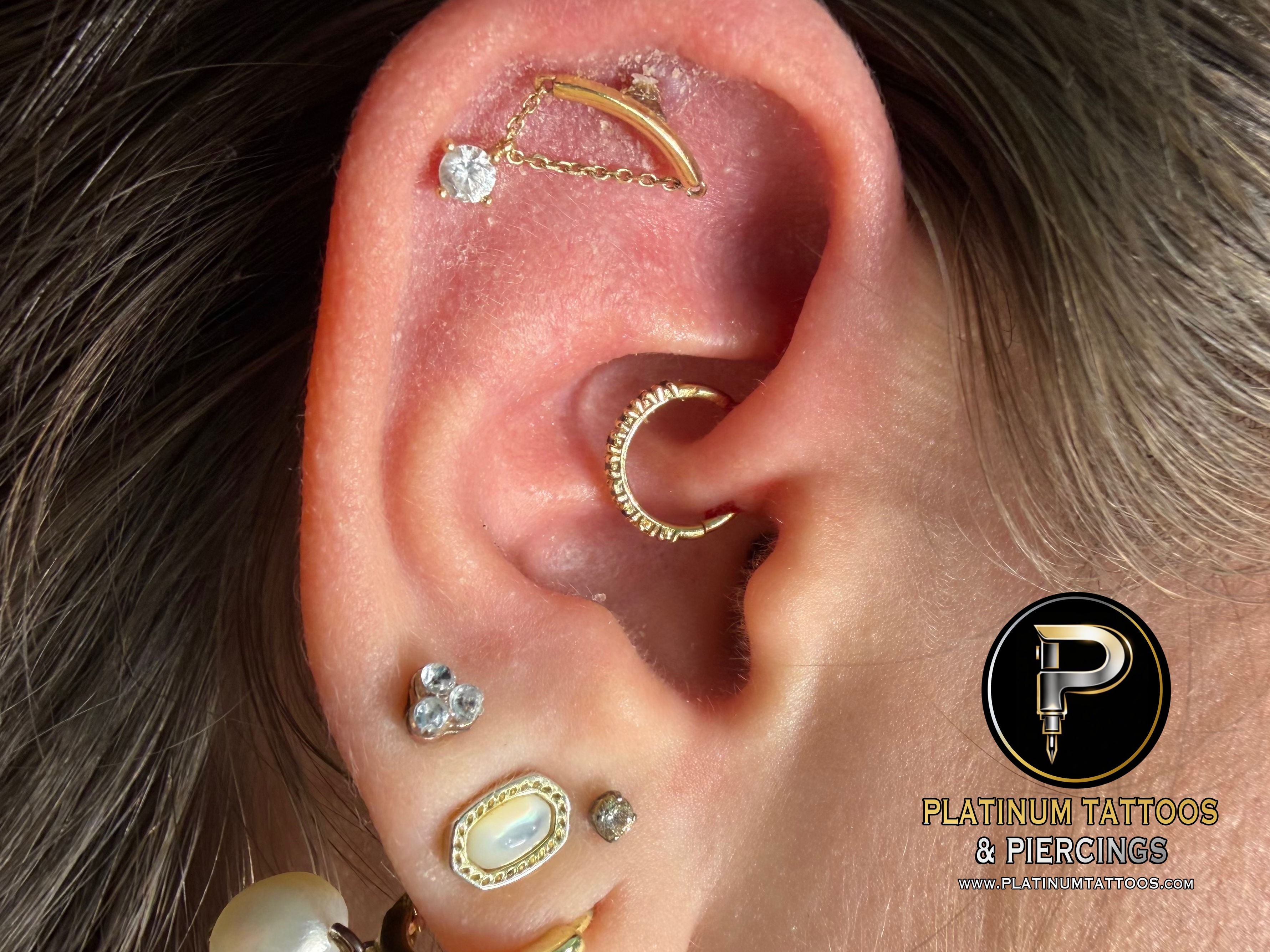 Daith piercing with 14k Yellow Gold Cluster/Multi-Gem by Tawapa by Mingo at Platinum Tattoos & Piercings, San Antonio TX