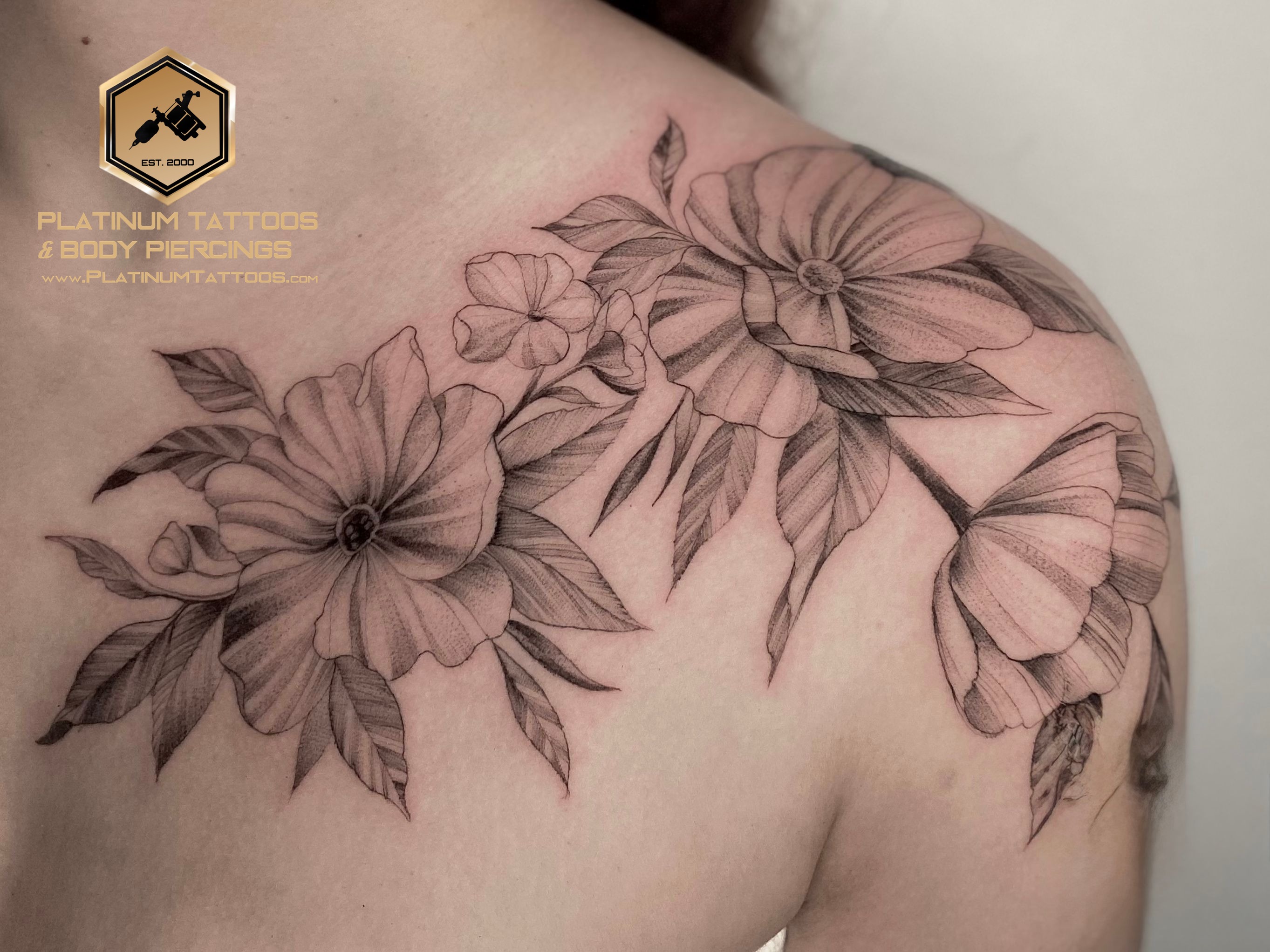 Floral tattoo on the chest by Remy at Platinum Tattoos & Piercings, San Antonio TX