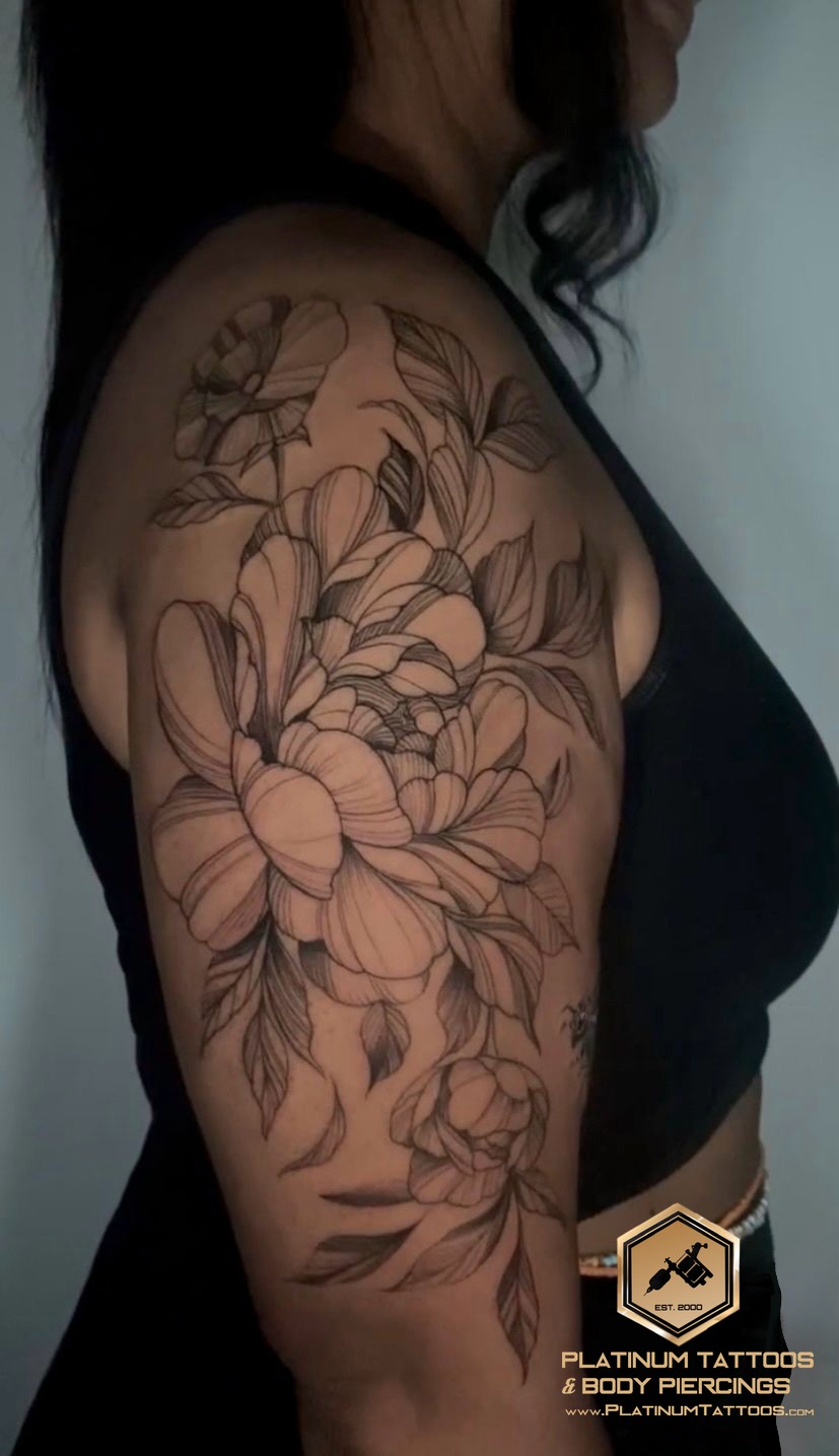 Floral tattoo by Remy at Platinum Tattoos & Piercings, San Antonio TX
