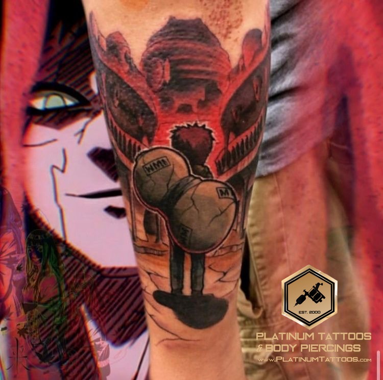 Anime tattoo on the calf at Platinum Tattoos & Piercings, San Antonio TX