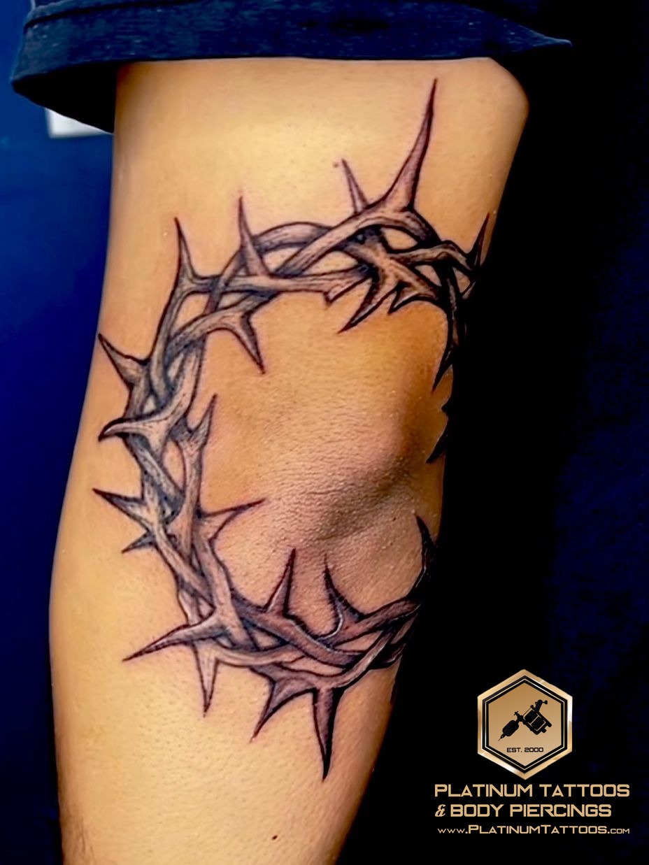 Tattoo on the elbow by Skar at Platinum Tattoos & Piercings, San Antonio TX