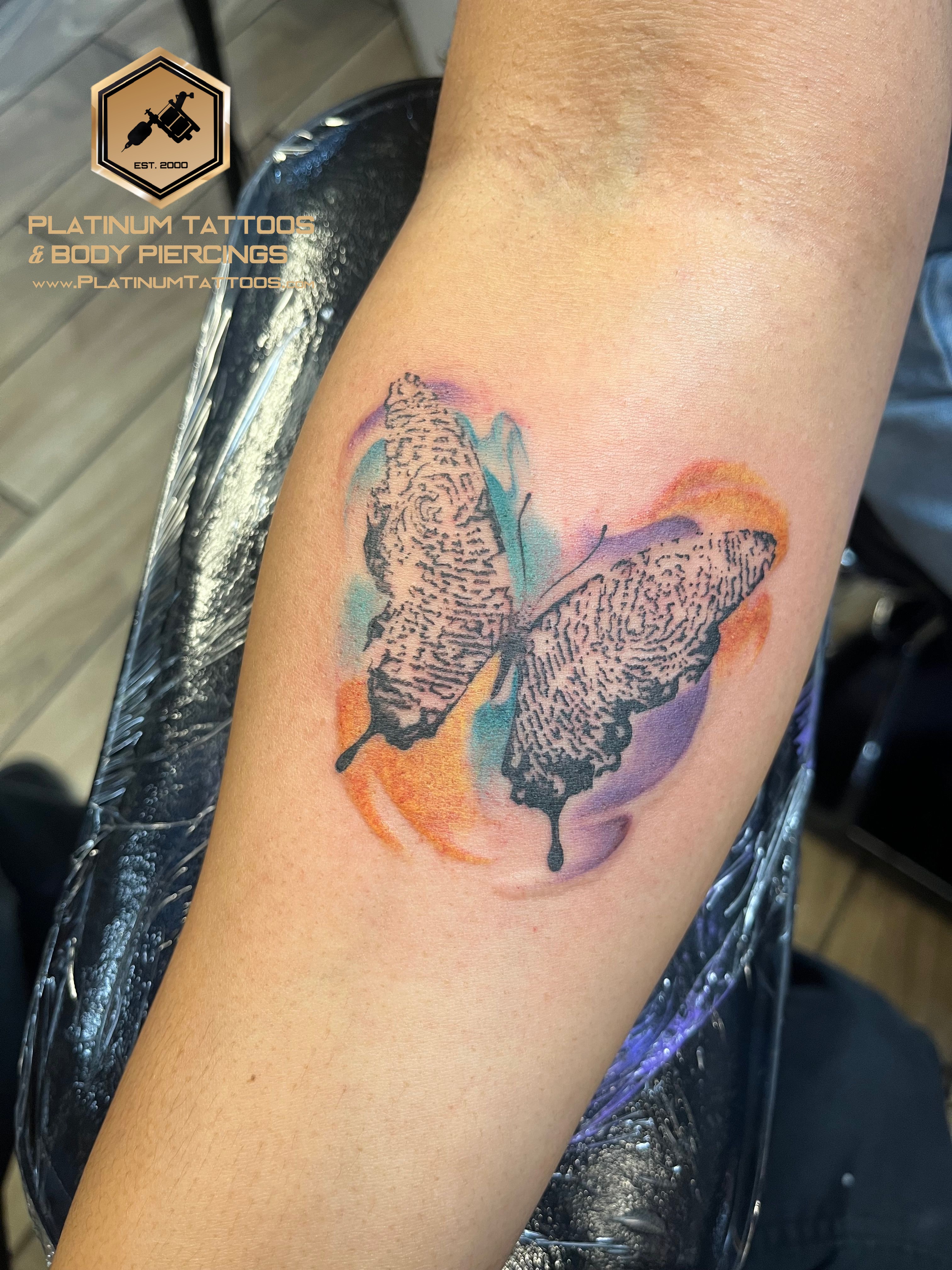 Watercolor tattoo on the forearm at Platinum Tattoos & Piercings, San Antonio TX