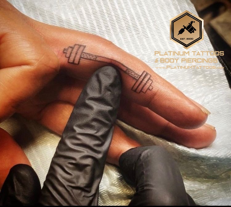 Blackwork tattoo on the finger at Platinum Tattoos & Piercings, San Antonio TX