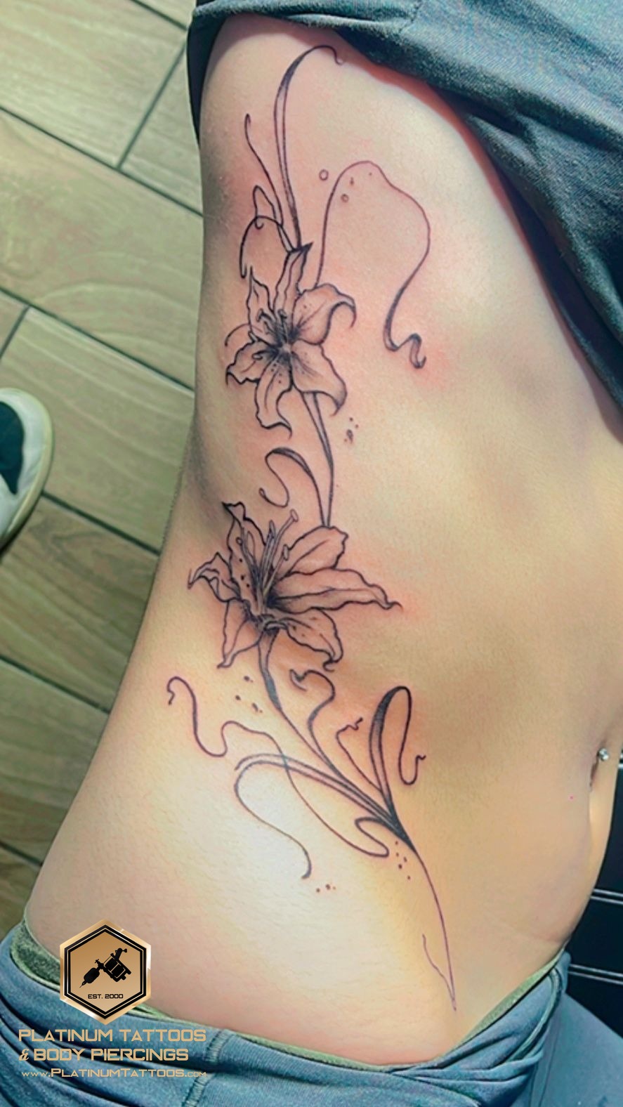 Floral tattoo on the ribs by Skar at Platinum Tattoos & Piercings, San Antonio TX