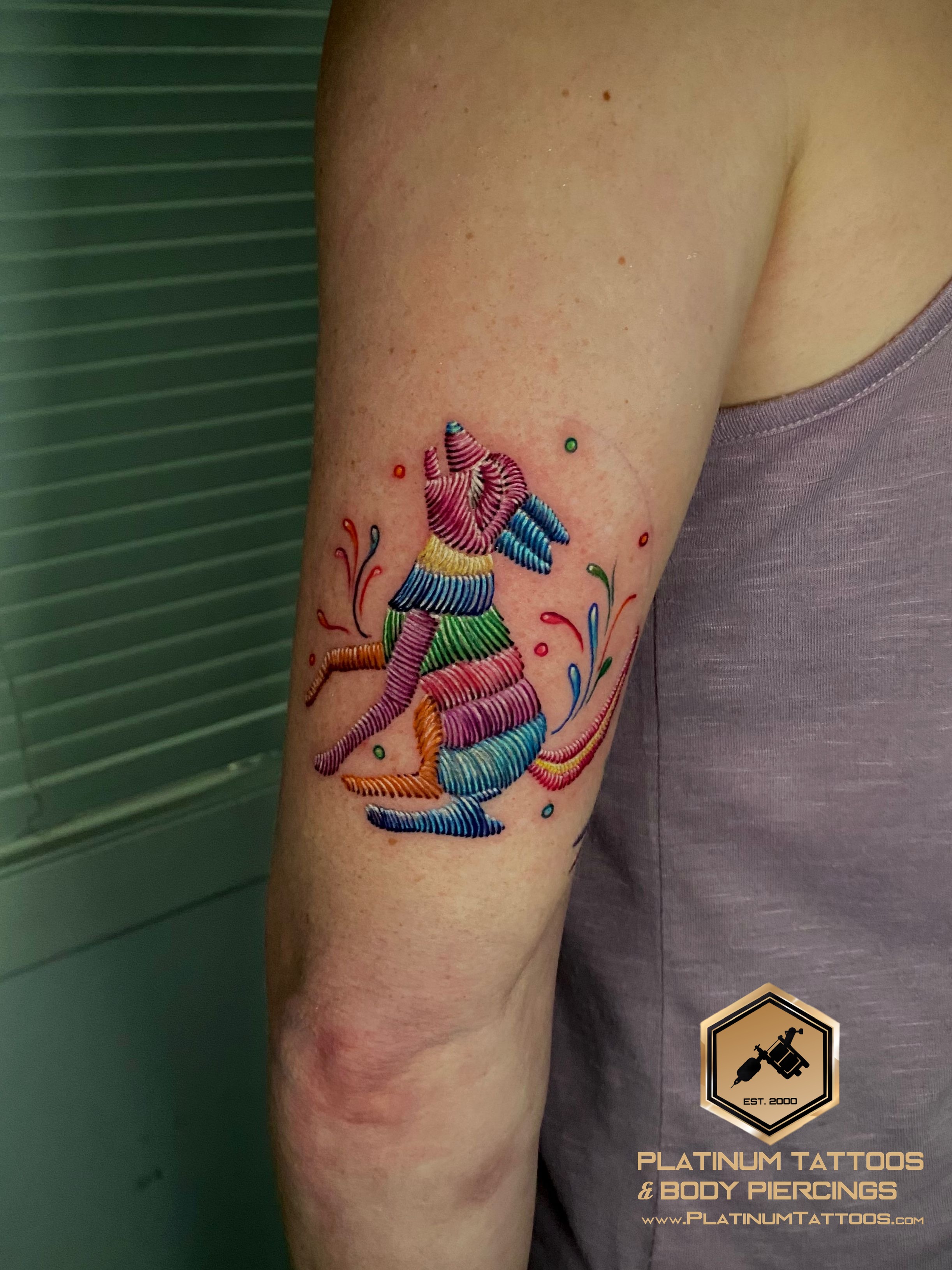 Embroidery Tattoo on the Tricep by Remy at Platinum Tattoos & Piercings, San Antonio TX