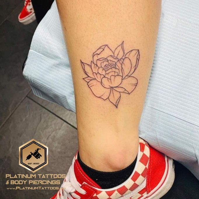 Floral tattoo on the ankle at Platinum Tattoos & Piercings, San Antonio TX