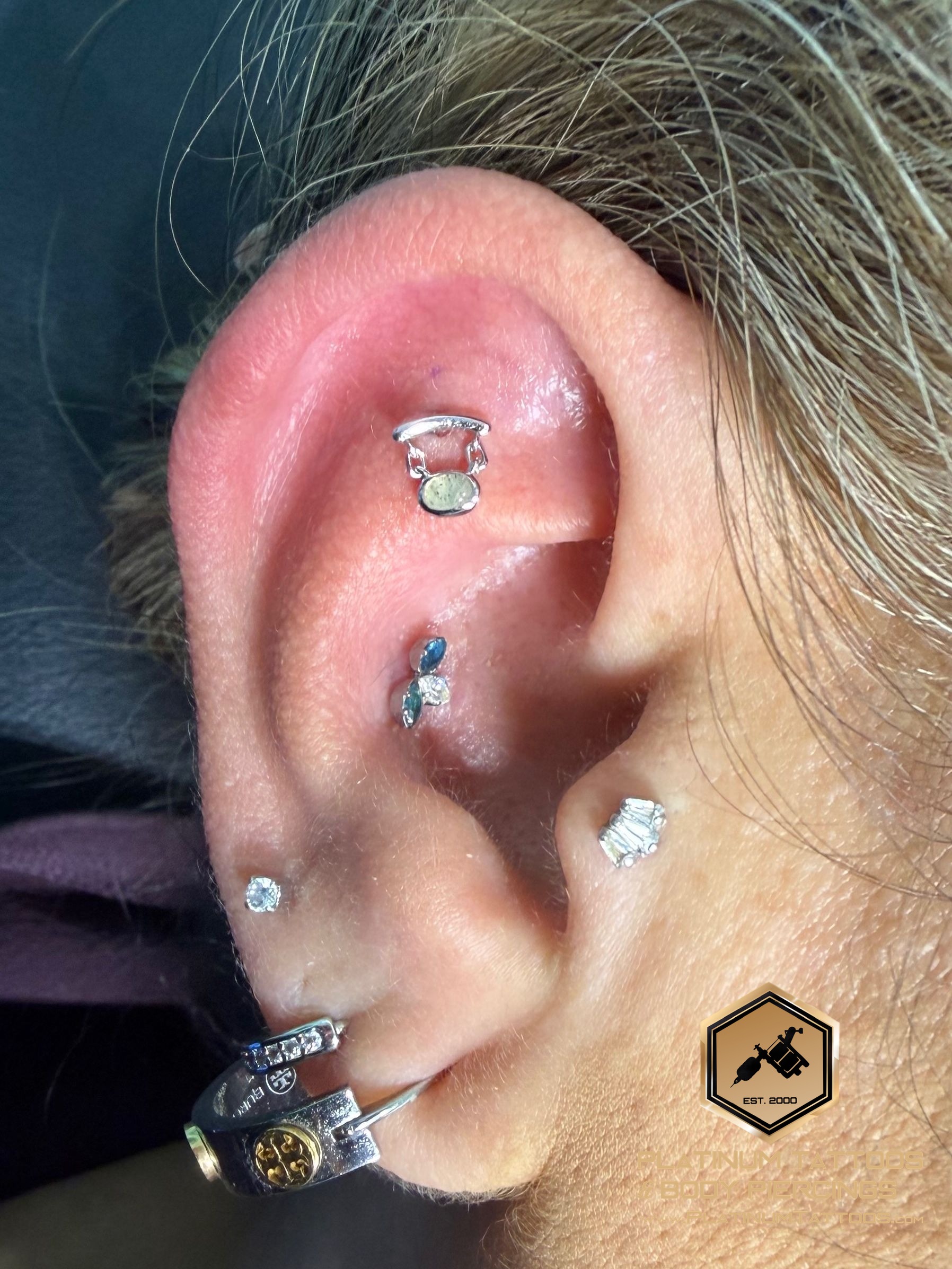 Flat piercing with 14k White Gold Cluster/Multi-Gem by Junipurr by Mingo at Platinum Tattoos & Piercings, San Antonio TX