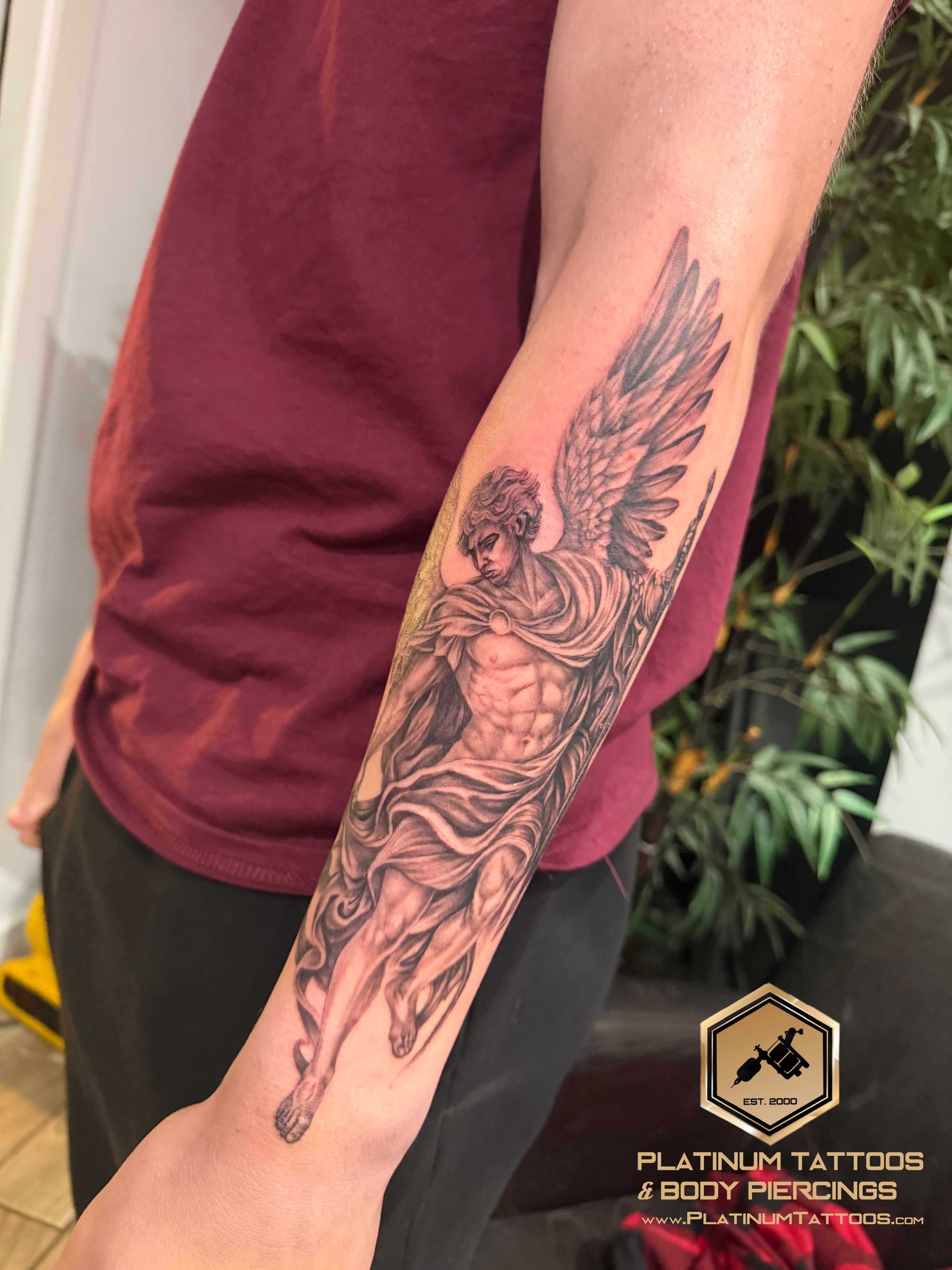 Black & Grey, Realism Black, Grey Sword, Angel tattoo on the Forearm at Platinum Tattoos & Piercings, San Antonio TX