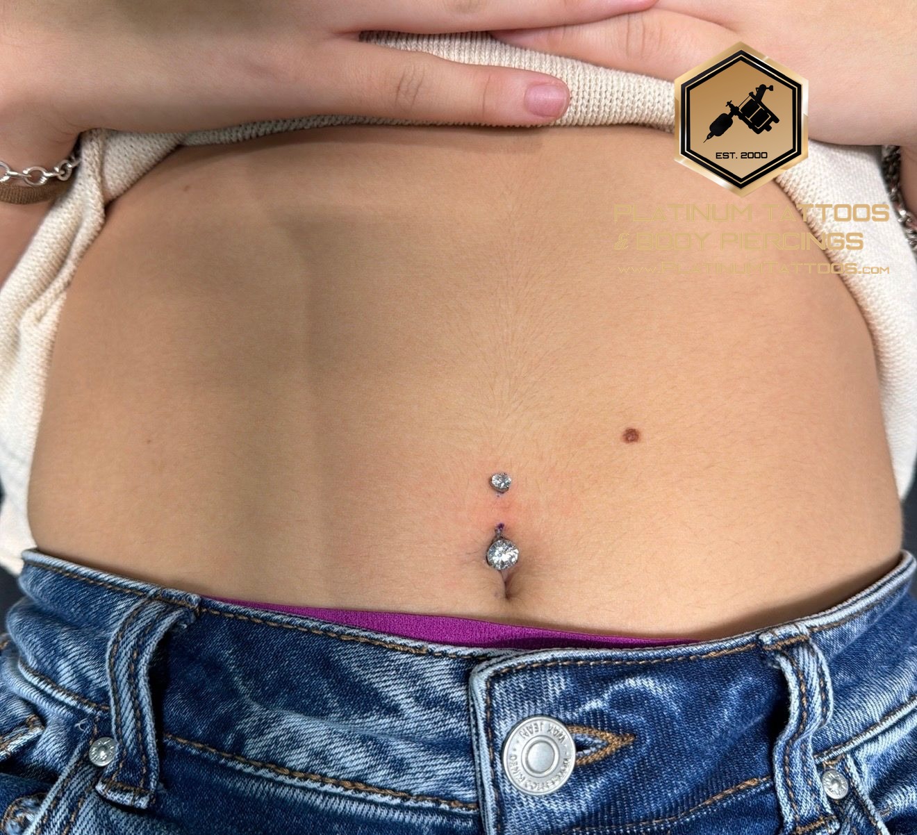Navel piercing with Implant Grade Titanium Curved Barbell by Other by Mingo at Platinum Tattoos & Piercings, San Antonio TX