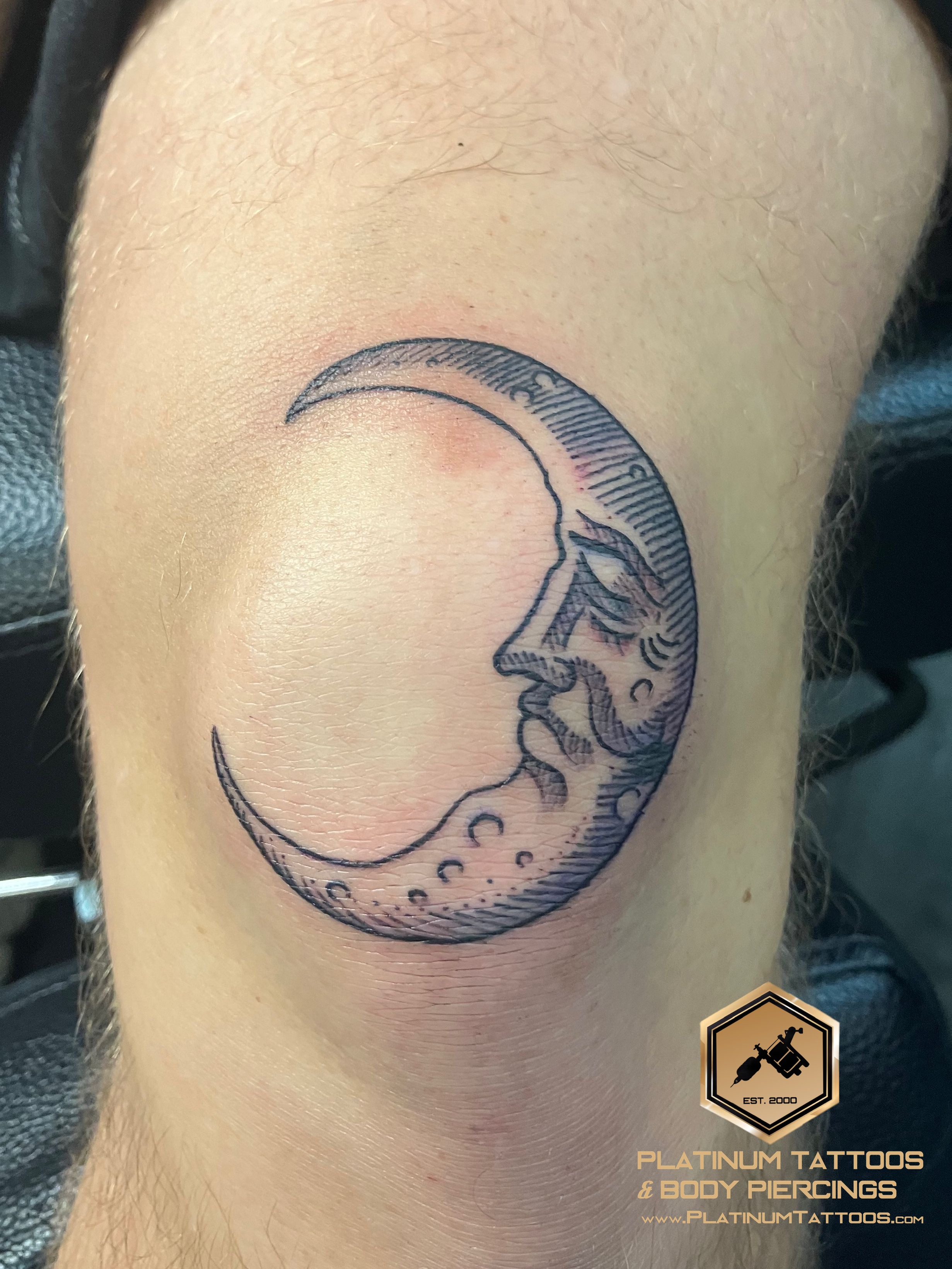 Blackwork, Traditional Black Moon tattoo on the Knee by Jr at Platinum Tattoos & Piercings, San Antonio TX