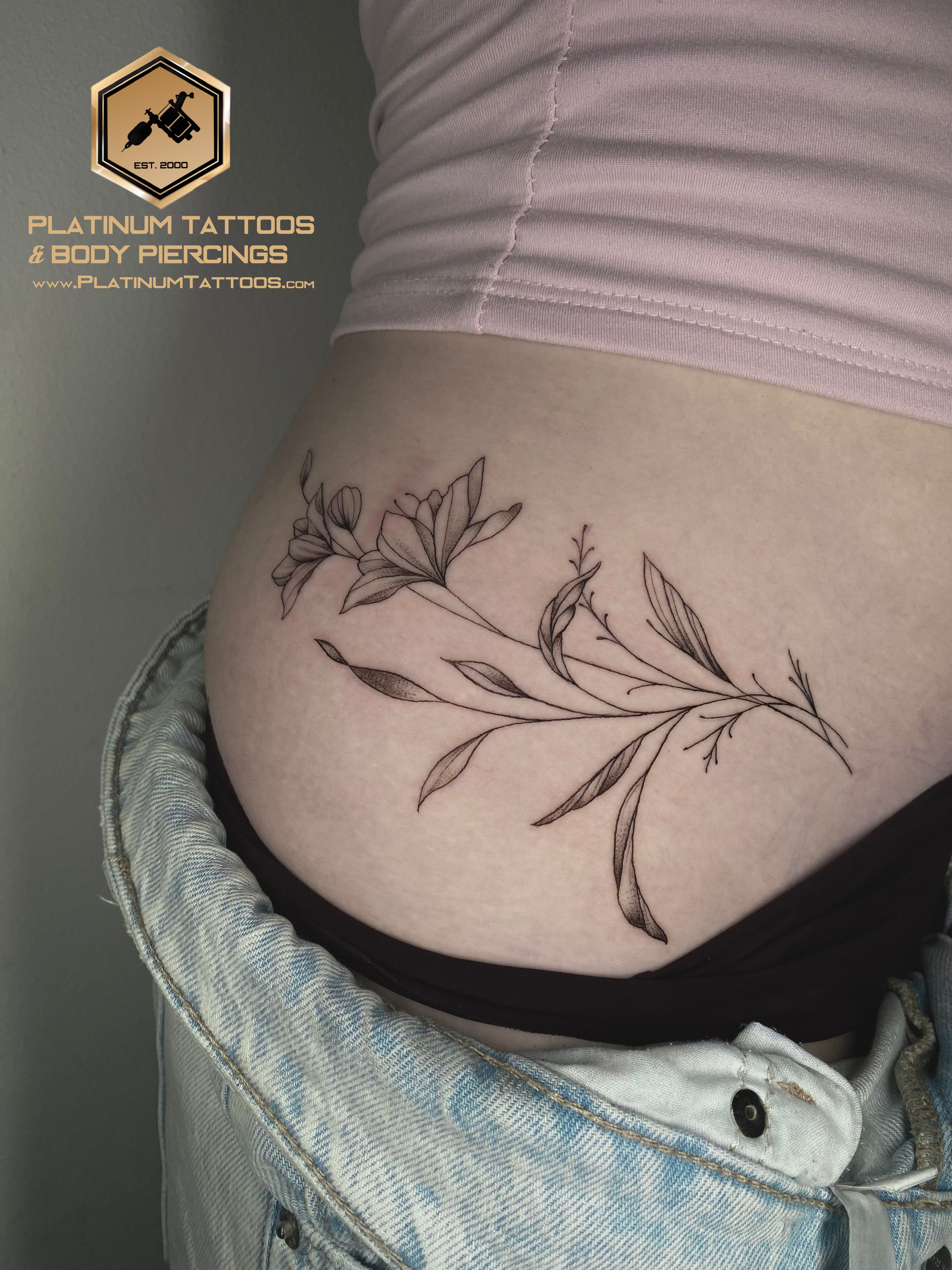Blackwork, Fine Line Black Flower tattoo on the Stomach by Remy at Platinum Tattoos & Piercings, San Antonio TX