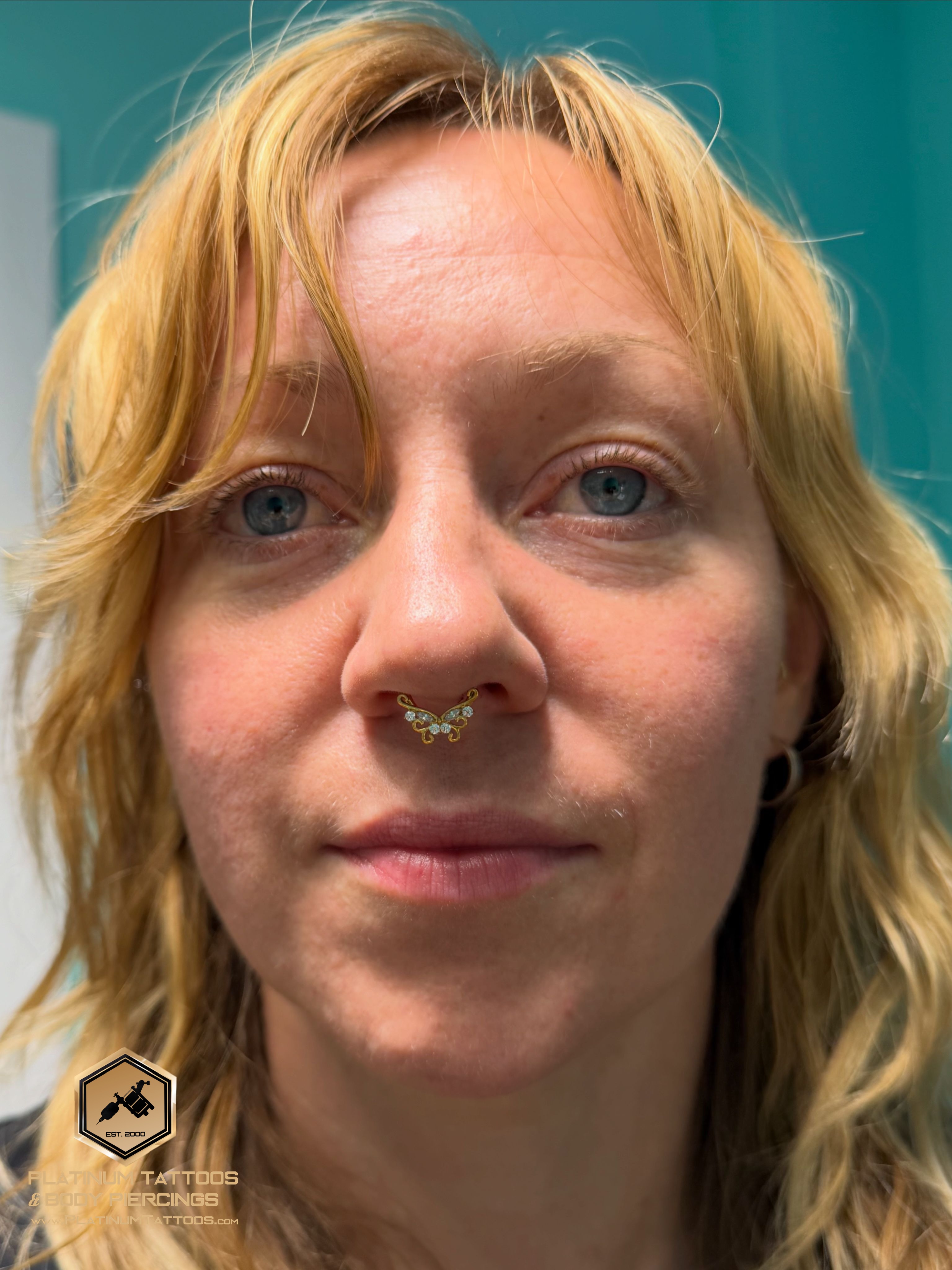 Septum piercing with Implant Grade Titanium Clicker by Other by Mingo at Platinum Tattoos & Piercings, San Antonio TX
