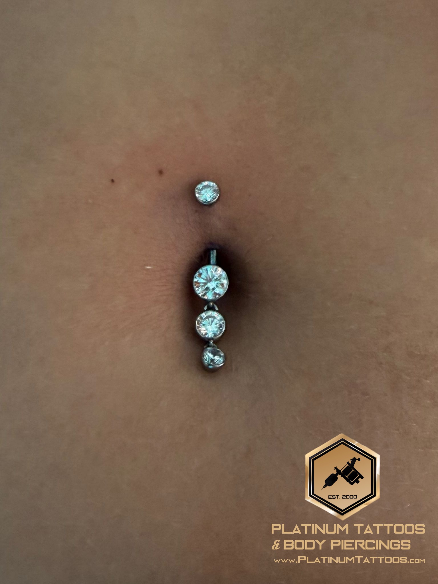 Belly Button piercing with Implant Grade Titanium Cluster/Multi-Gem by LeRoi by Mingo at Platinum Tattoos & Piercings, San Antonio TX
