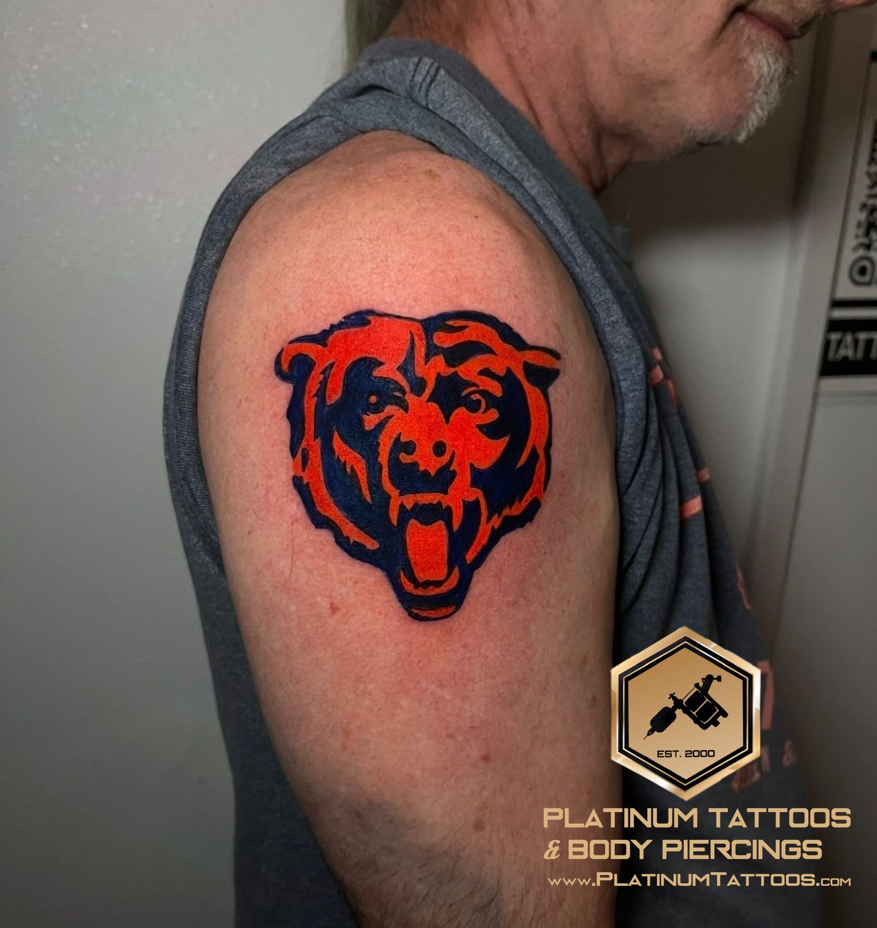 Color Blue, Orange tattoo on the Upper Arm by Skar at Platinum Tattoos & Body Piercings, San Antonio TX