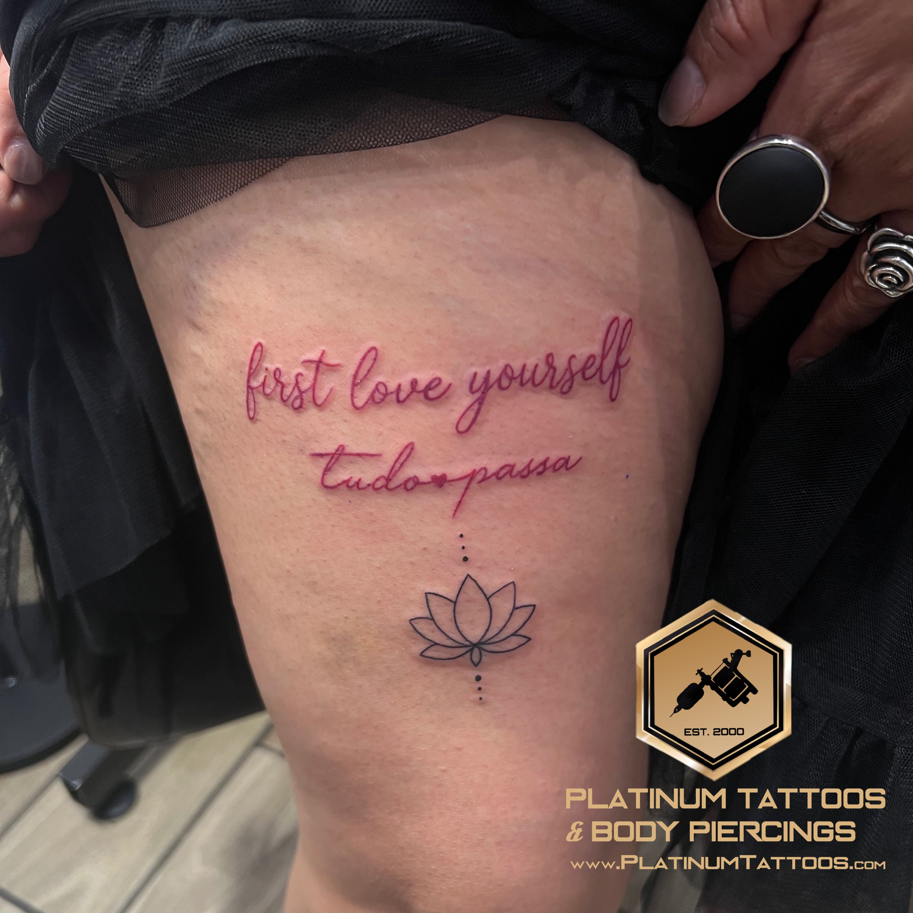 Lettering, Floral Black, Red Lotus, Script/Cursive tattoo on the Thigh by Jesus at Platinum Tattoos & Body Piercings, San Antonio TX