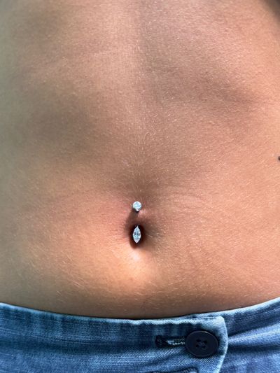 Belly Button piercing with Implant Grade Titanium Curved Barbell by Other by Mingo at Platinum Tattoos & Piercings, San Antonio TX