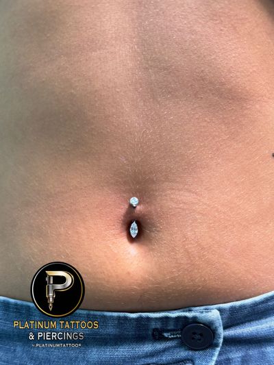 Belly Button piercing with Implant Grade Titanium Curved Barbell by Other by Mingo at Platinum Tattoos & Piercings, San Antonio TX