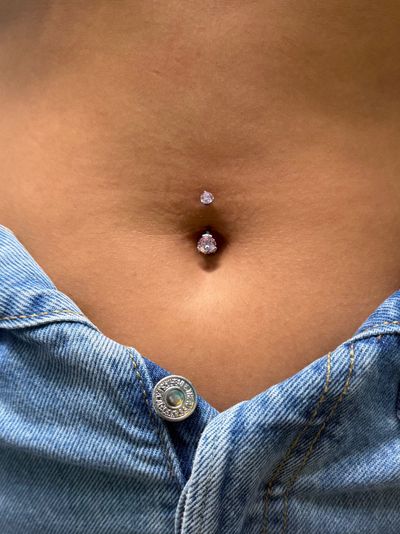 Belly Button piercing with Implant Grade Titanium Curved Barbell by Industrial Strength by Mingo at Platinum Tattoos & Piercings, San Antonio TX