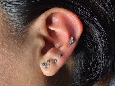 Curated ear piercing setup — 3rd Lobe, 1st Helix with Implant Grade Titanium Star, Cluster/Multi-Gem by NeoMetal by Mingo at Platinum Tattoos & Piercings, San Antonio TX