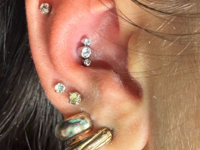 Conch piercing with Implant Grade Titanium Cluster/Multi-Gem by NeoMetal by Mingo at Platinum Tattoos & Piercings, San Antonio TX