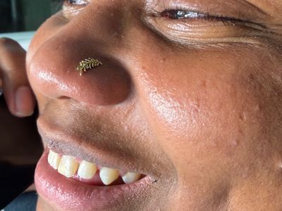 Nostril piercing with 14k Yellow Gold Threadless by Mingo at Platinum Tattoos & Piercings, San Antonio TX