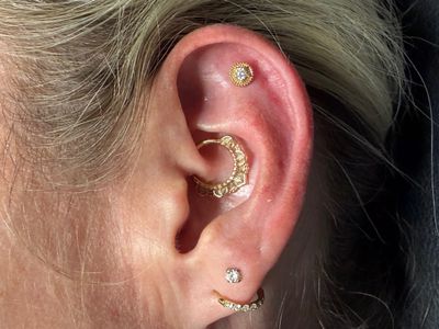 Flat piercing with 14k Yellow Gold Threadless by Tawapa by Mingo at Platinum Tattoos & Piercings, San Antonio TX