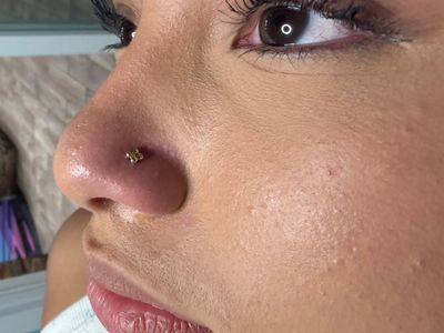 Nostril piercing with 14k Yellow Gold Threadless by Modern Mood by Mingo at Platinum Tattoos & Piercings, San Antonio TX