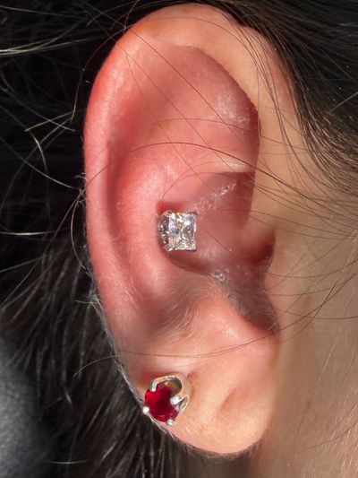 Conch piercing with Implant Grade Titanium Threadless by NeoMetal by Mingo at Platinum Tattoos & Piercings, San Antonio TX