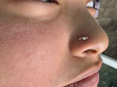 Nostril piercing with 14k Yellow Gold Cluster/Multi-Gem by Mingo at Platinum Tattoos & Piercings, San Antonio TX