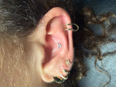 Conch piercing with Implant Grade Titanium Labret Stud/Flat Back by NeoMetal by Mingo at Platinum Tattoos & Piercings, San Antonio TX