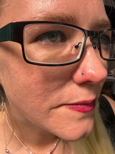 Nostril piercing with Implant Grade Titanium Labret Stud/Flat Back by NeoMetal by Mingo at Platinum Tattoos & Piercings, San Antonio TX